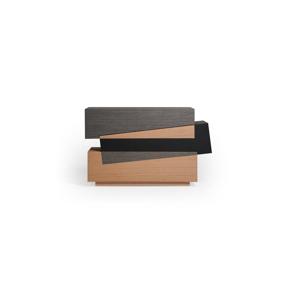 Modern stacked console table with three horizontal tiers in dark gray, black, and light wood finishes. Features layered rectangular sections with visible wood grain and sharp edges. Intended for hallway or entryway display. Category: furniture/console-tables