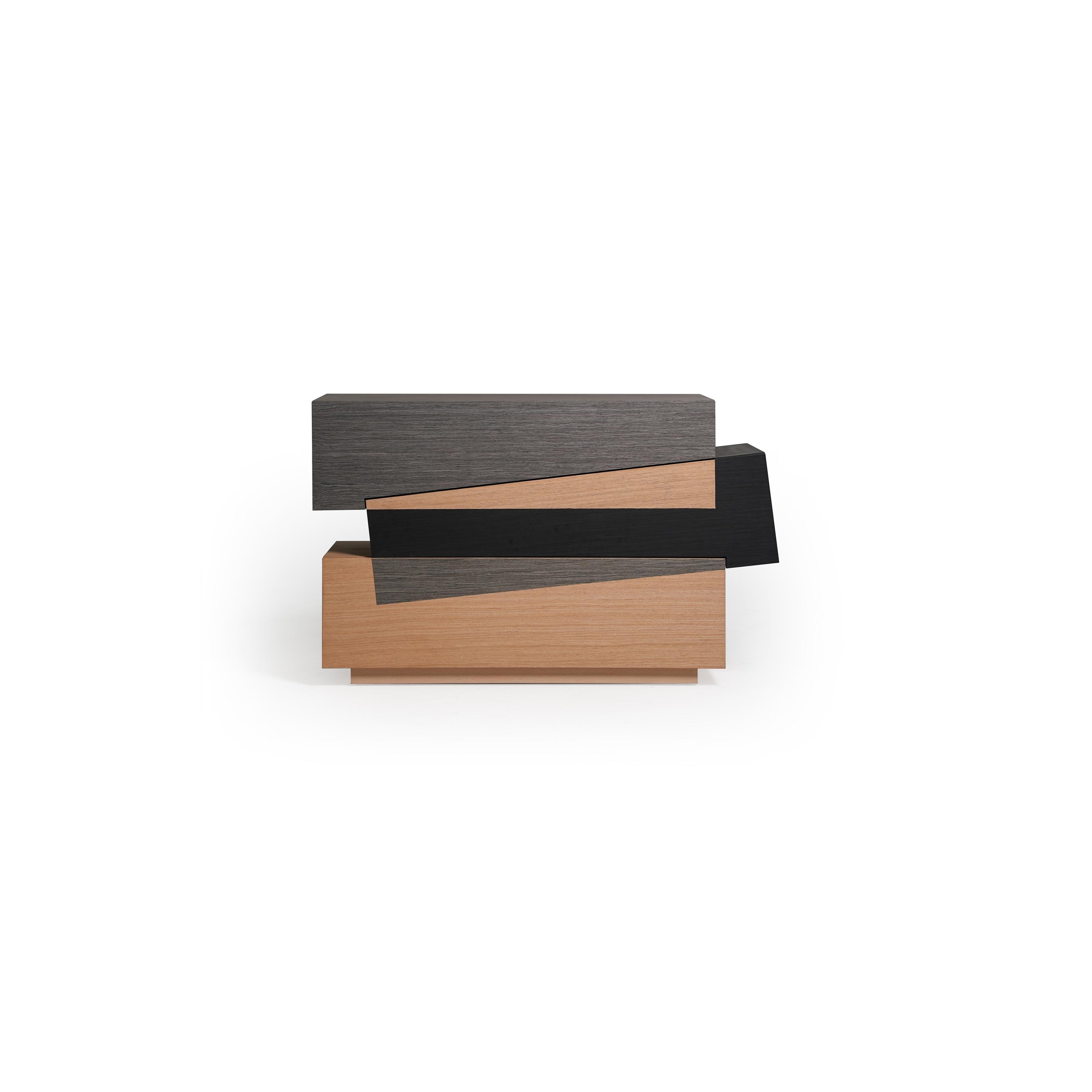 Modern stacked console table with three horizontal tiers in dark gray, black, and light wood finishes. Features layered rectangular sections with visible wood grain and sharp edges. Intended for hallway or entryway display. Category: furniture/console-tables