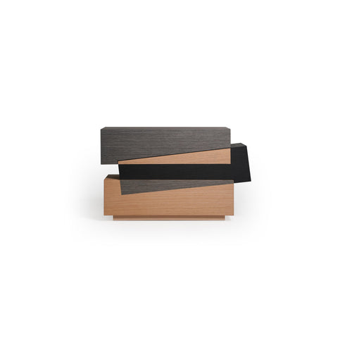 Modern stacked console table with three horizontal tiers in dark gray, black, and light wood finishes. Features layered rectangular sections with visible wood grain and sharp edges. Intended for hallway or entryway display. Category: furniture/console-tables