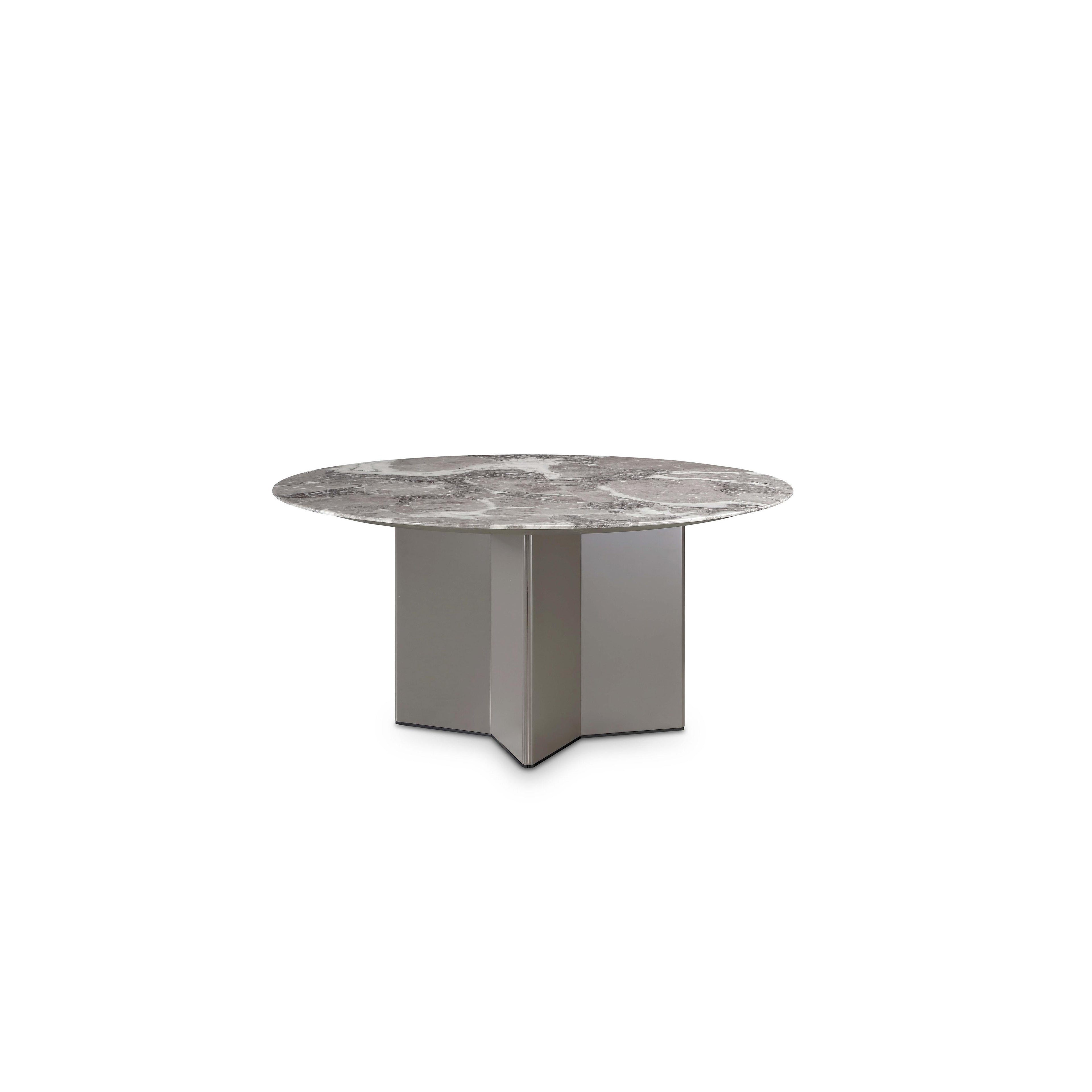 A round table with a gray marble top featuring natural veining, supported by a three-panel metallic base with angular edges and a matte finish, designed for dining or workspaces. Category: Furniture > Tables > Dining Tables