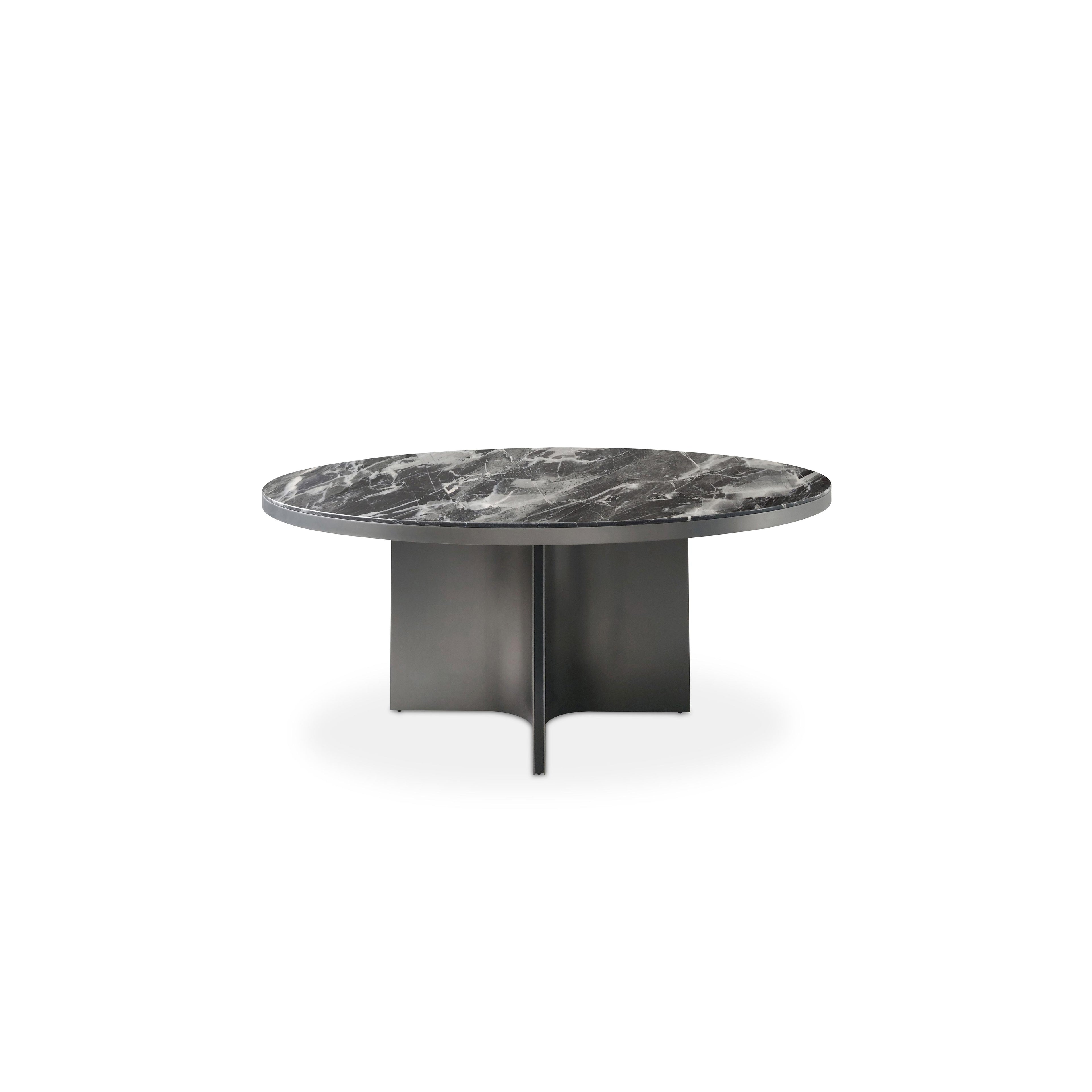 Round dining table with dark gray marble top and matte black metal base featuring three curved legs. Smooth, polished surface with natural veining. Structurally supported by central pillar and side supports. Intended for dining or serving. Category: furniture/dining-tables