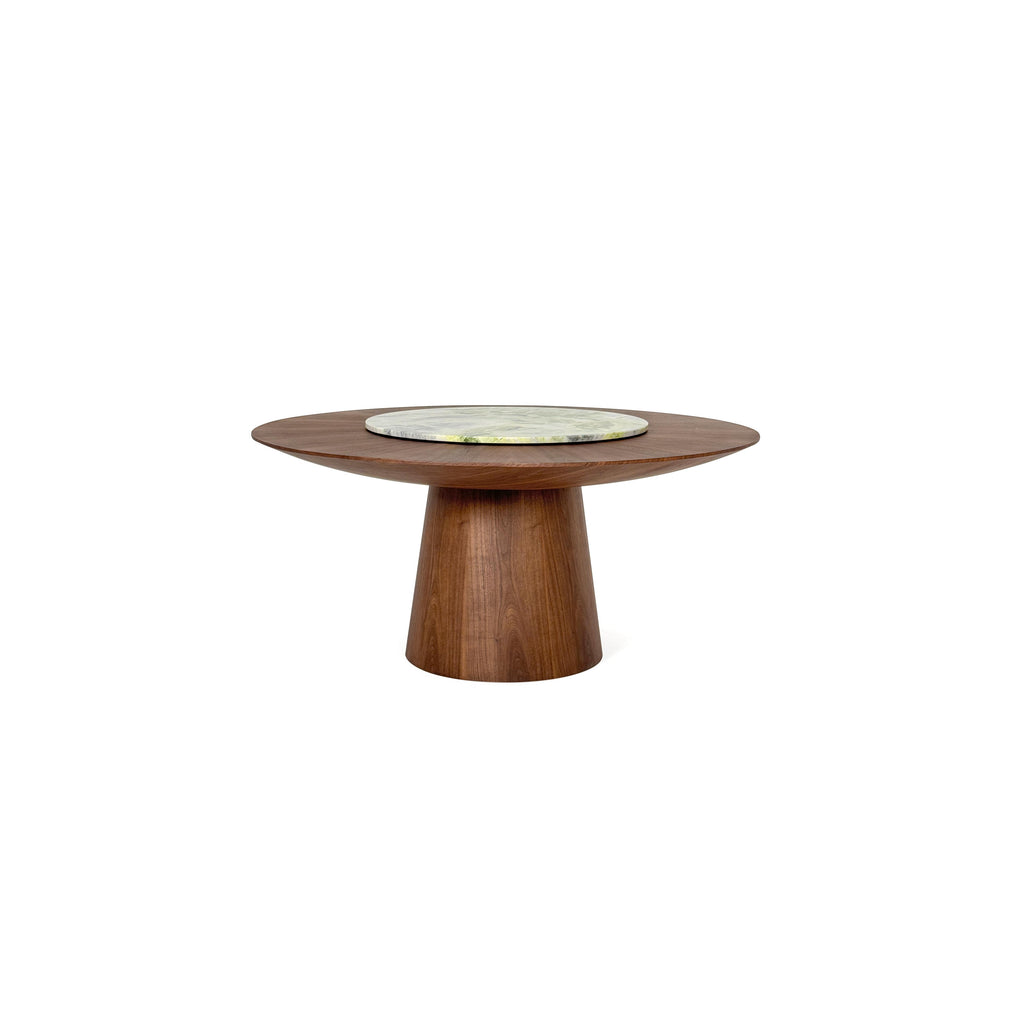 Round dining table with dark wood base and matching top, featuring a central circular stone slab with green and white veining. Solid wood construction with tapered pedestal leg. Intended for dining or serving. Category: furniture/dining-tables