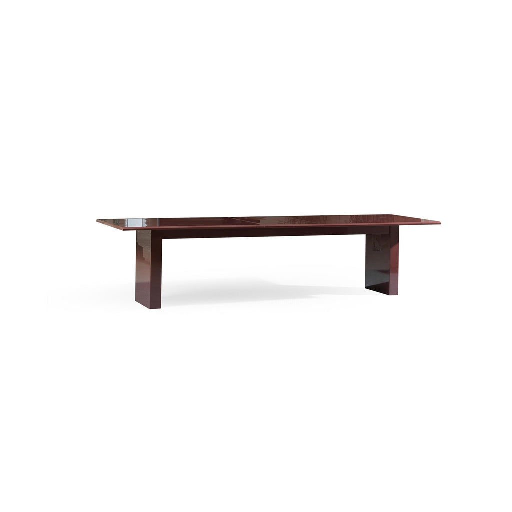 A rectangular dining table with a glossy dark reddish-brown surface and matching legs, featuring a central seam suggesting extendable functionality, supported by two vertical rectangular legs with a slight taper, intended for seating and dining, Category: Furniture > Dining Tables > Extendable Dining Tables.