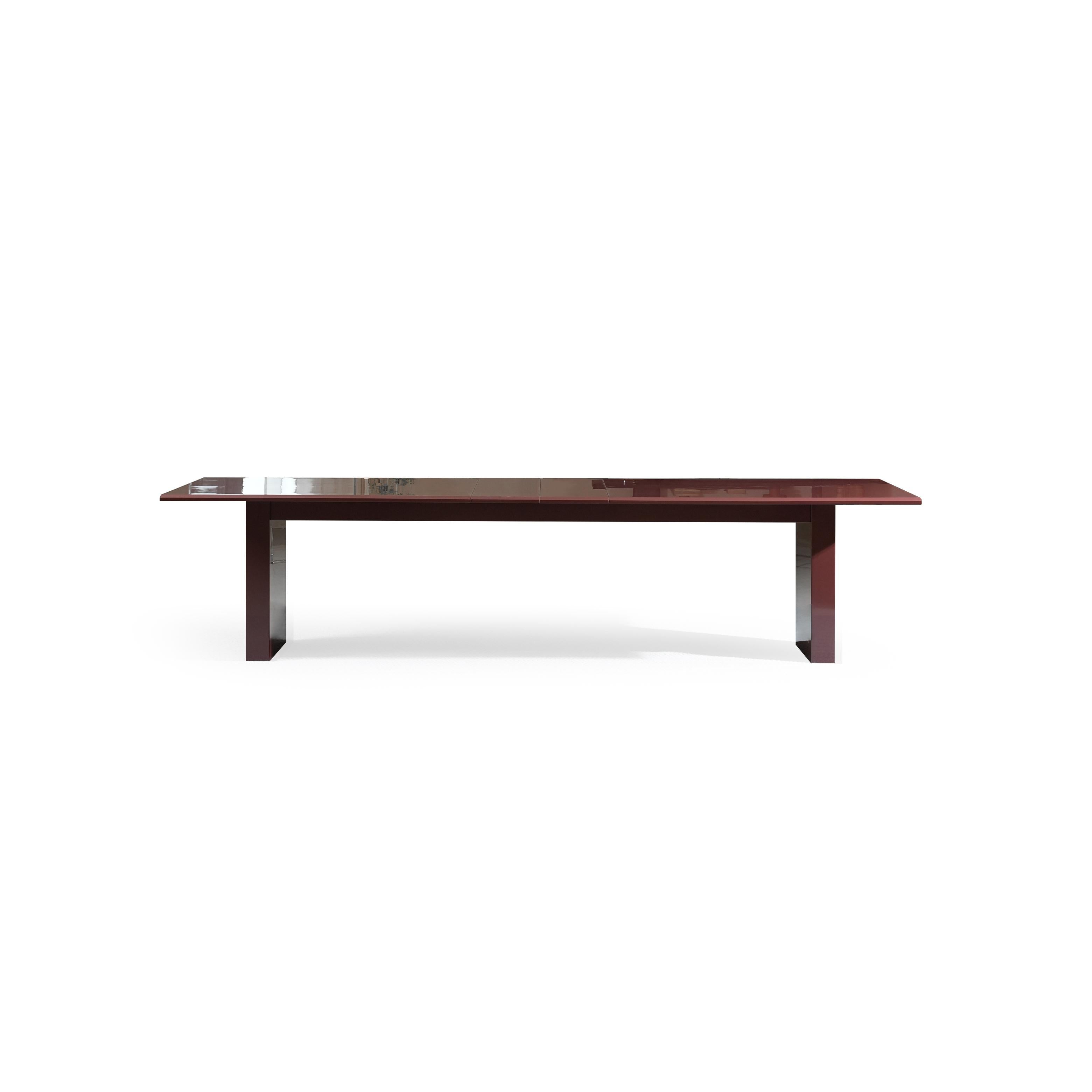 A rectangular dining table with a glossy dark reddish-brown surface and matching legs, featuring a central seam suggesting extendable functionality, supported by two vertical rectangular legs with a slight taper, intended for seating and dining, Category: Furniture > Dining Tables > Extendable Dining Tables.