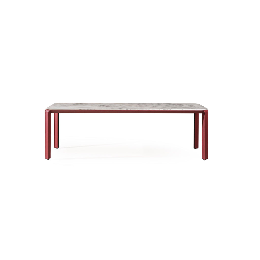 Rectangular coffee table with a light gray marble top and reddish-brown metal legs. Four straight legs support the flat surface. Minimalist design, no visible handles or fasteners. Intended for placing items on a living room floor. Category: furniture/coffee-tables