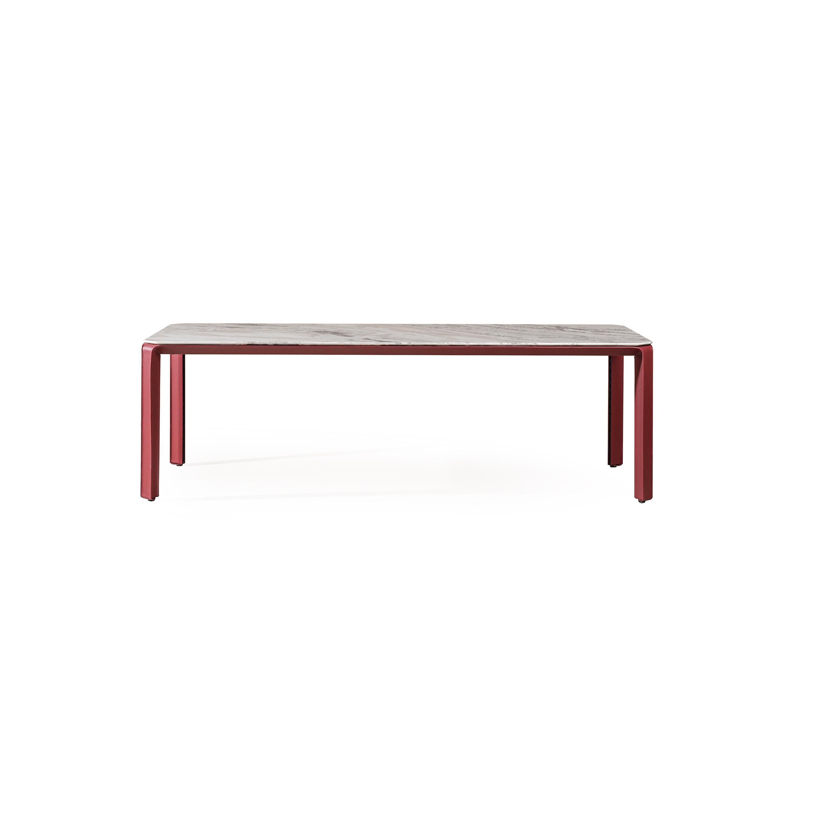 Rectangular coffee table with a light gray marble top and reddish-brown metal legs. Four straight legs support the flat surface. Minimalist design, no visible handles or fasteners. Intended for placing items on a living room floor. Category: furniture/coffee-tables
