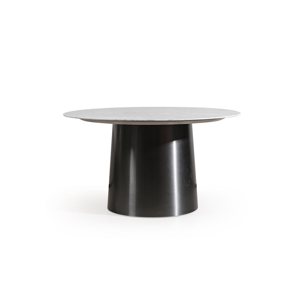 Round dining table with a marble top featuring light gray base and golden veining, supported by a cylindrical dark metal pedestal base. The table has a concentric circular design with a smaller circular inset on the surface. Intended for dining or serving. Category: furniture/dining-tables