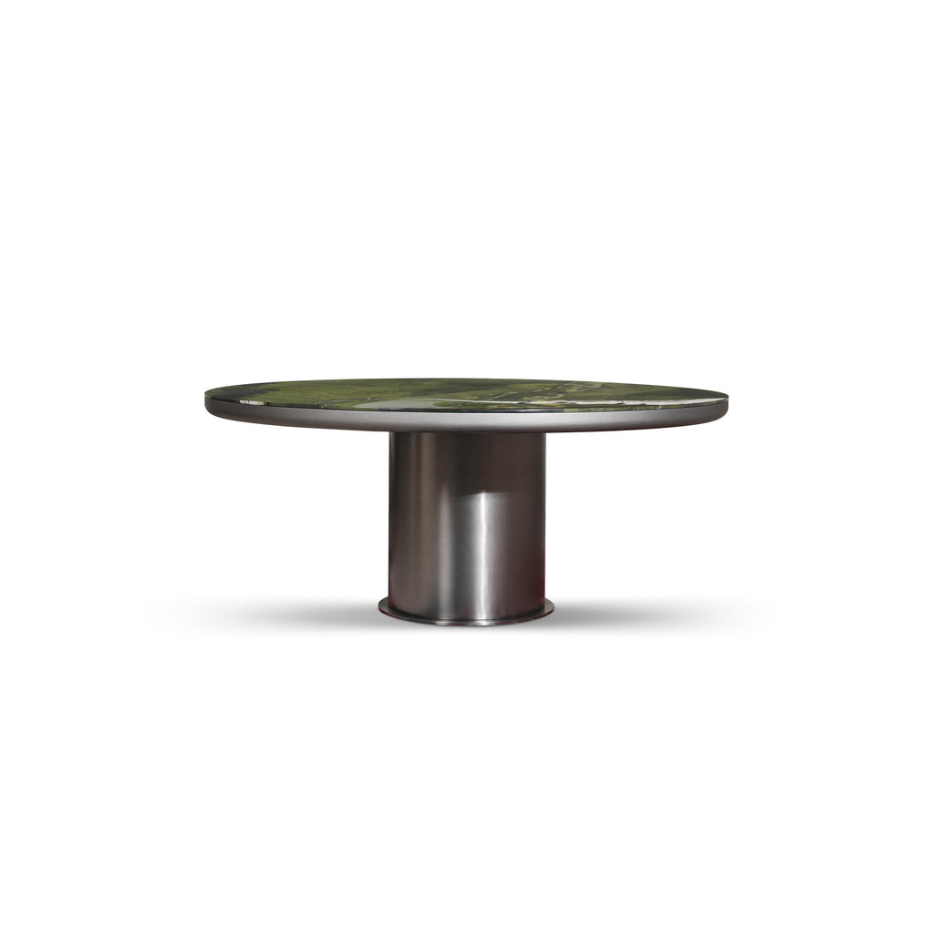 Round dining table with a green-toned, textured top surface and a cylindrical metallic base. The table has a single central support leg and is designed for seating. Category: furniture/dining-tables