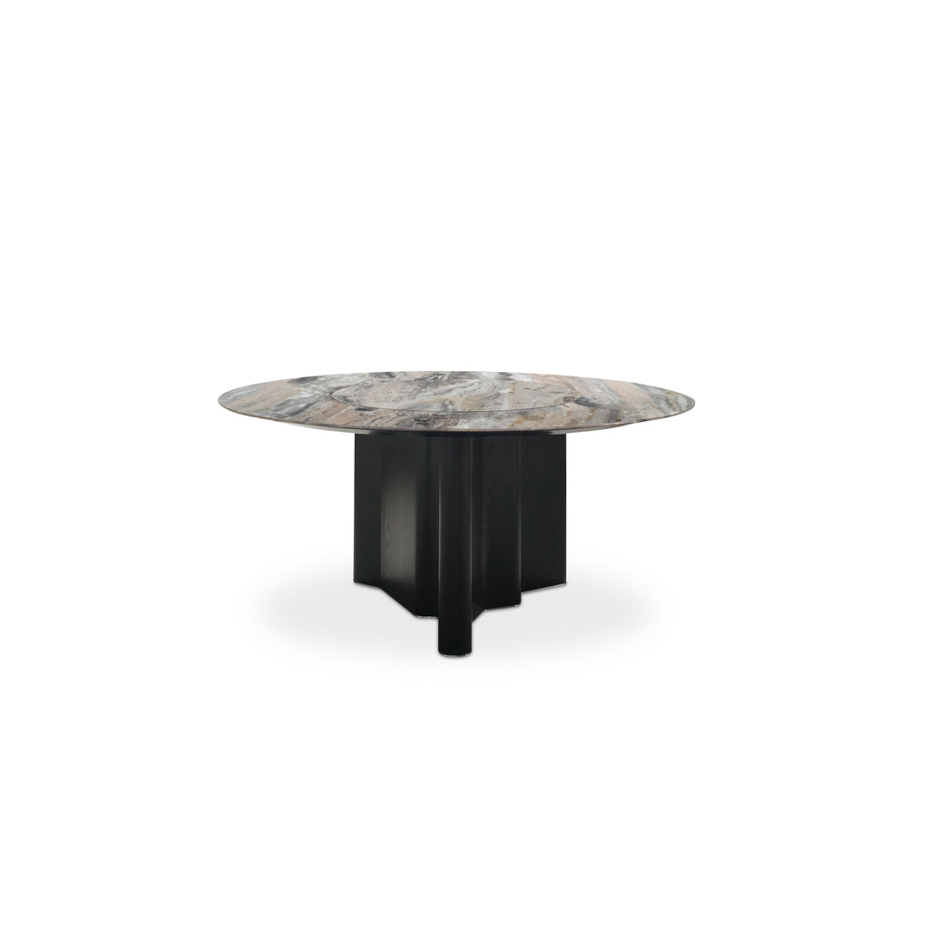 Round dining table with a marble top displaying gray, beige, and brown veining, supported by a dark-stained wooden base with four vertical legs and a central pedestal. Intended for dining, featuring a flat, circular surface and sturdy, angular support structure. Category: furniture/dining-tables