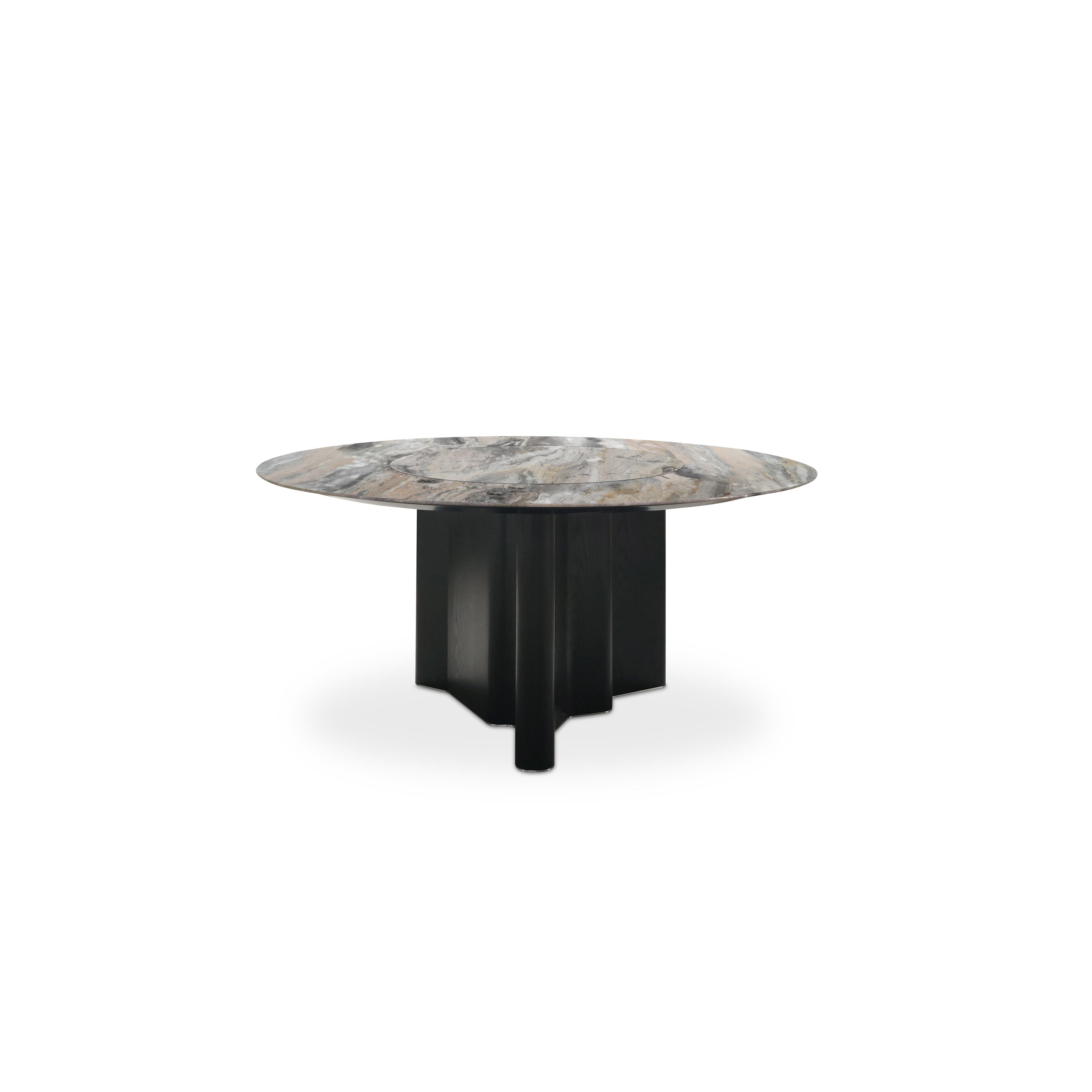 Round dining table with a marble top displaying gray, beige, and brown veining, supported by a dark-stained wooden base with four vertical legs and a central pedestal. Intended for dining, featuring a flat, circular surface and sturdy, angular support structure. Category: furniture/dining-tables