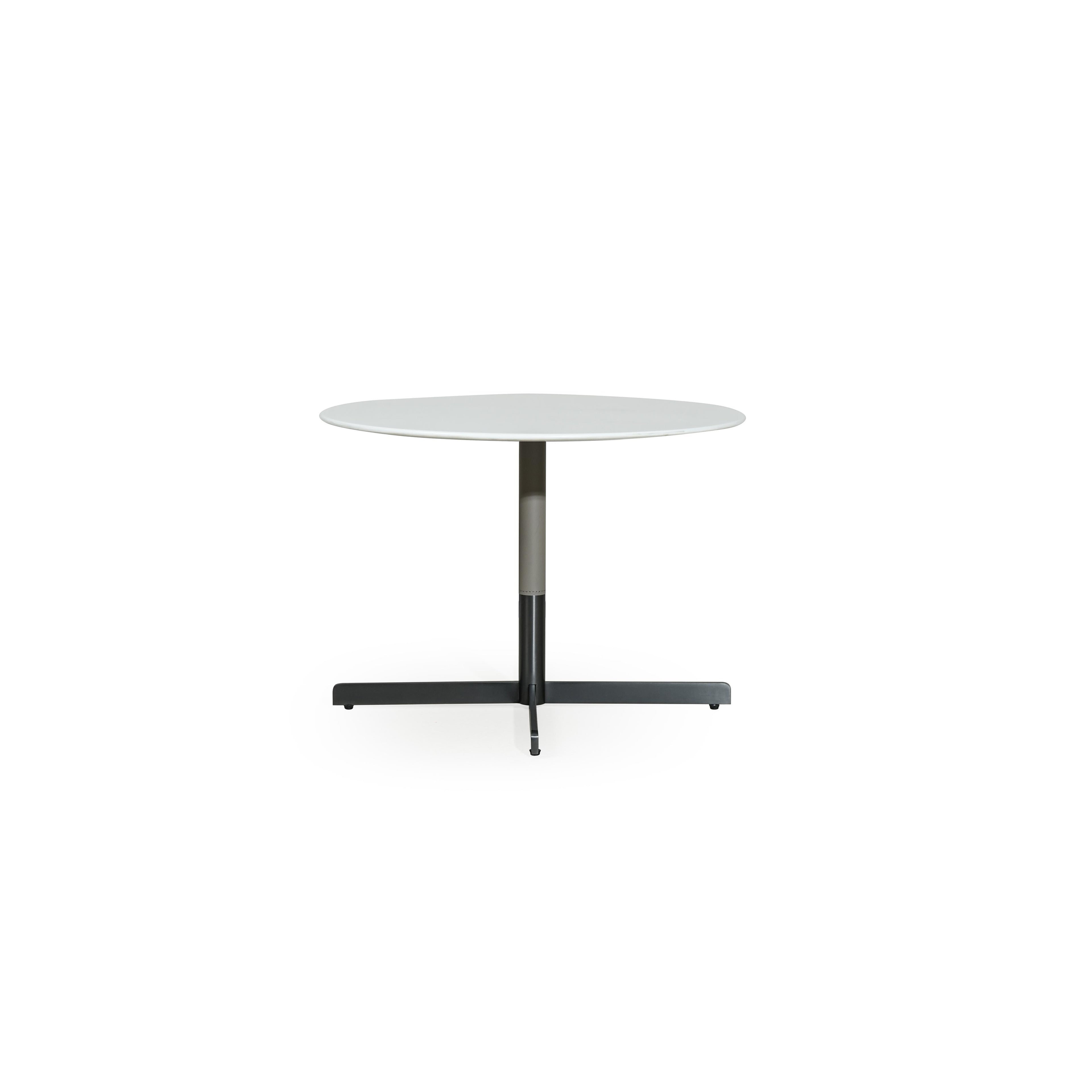 Round table with white top and dark metal base, featuring a central column and X-shaped cross legs. Minimalist design with smooth surfaces and no visible upholstery or handles. Intended for dining or workspaces. Category: furniture > tables > round tables