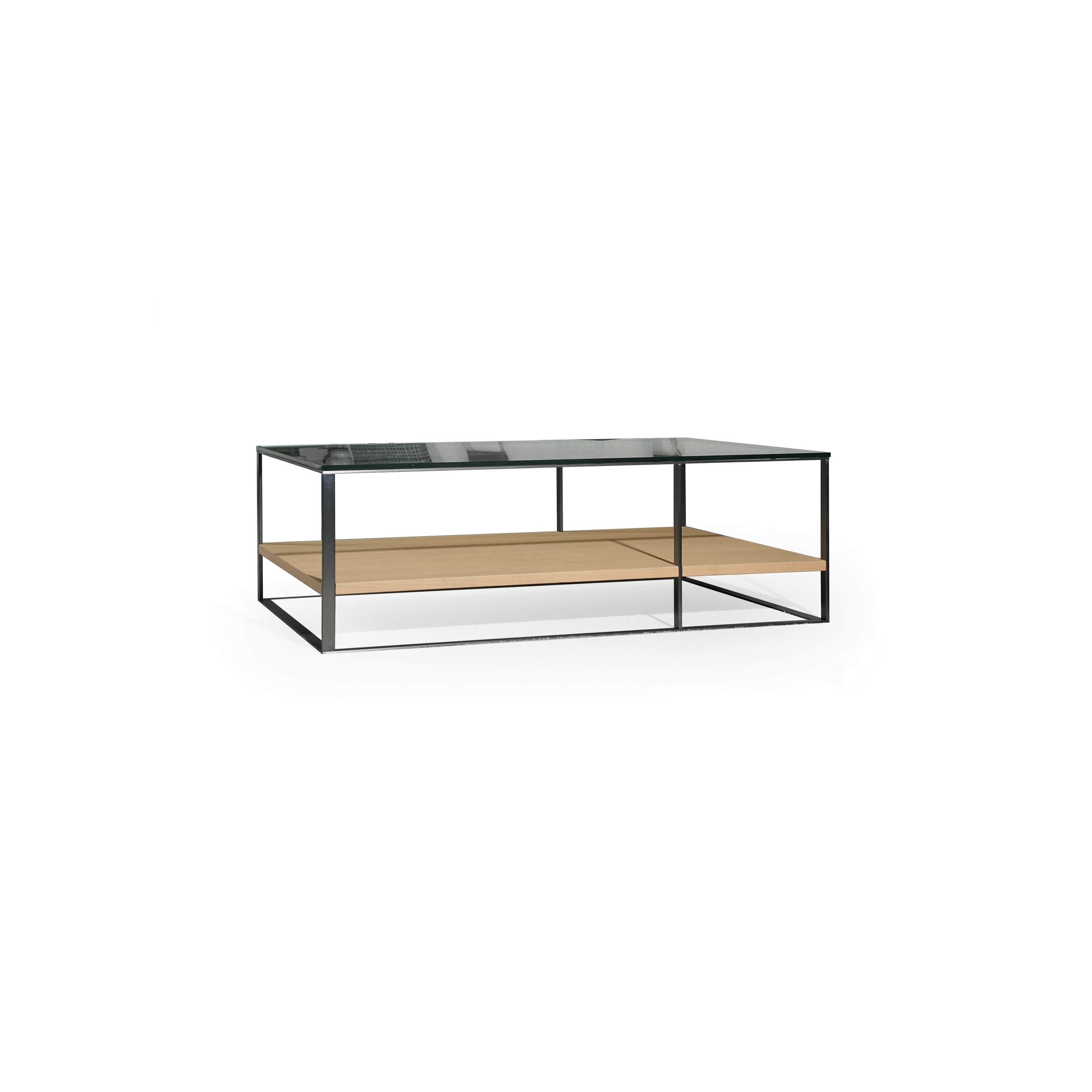 Rectangular coffee table with black metal frame and glass top, featuring a light wood shelf below. Two-tiered structure with visible metal legs and horizontal supports. Designed for surface placement in living areas. Category: furniture/coffee-tables
