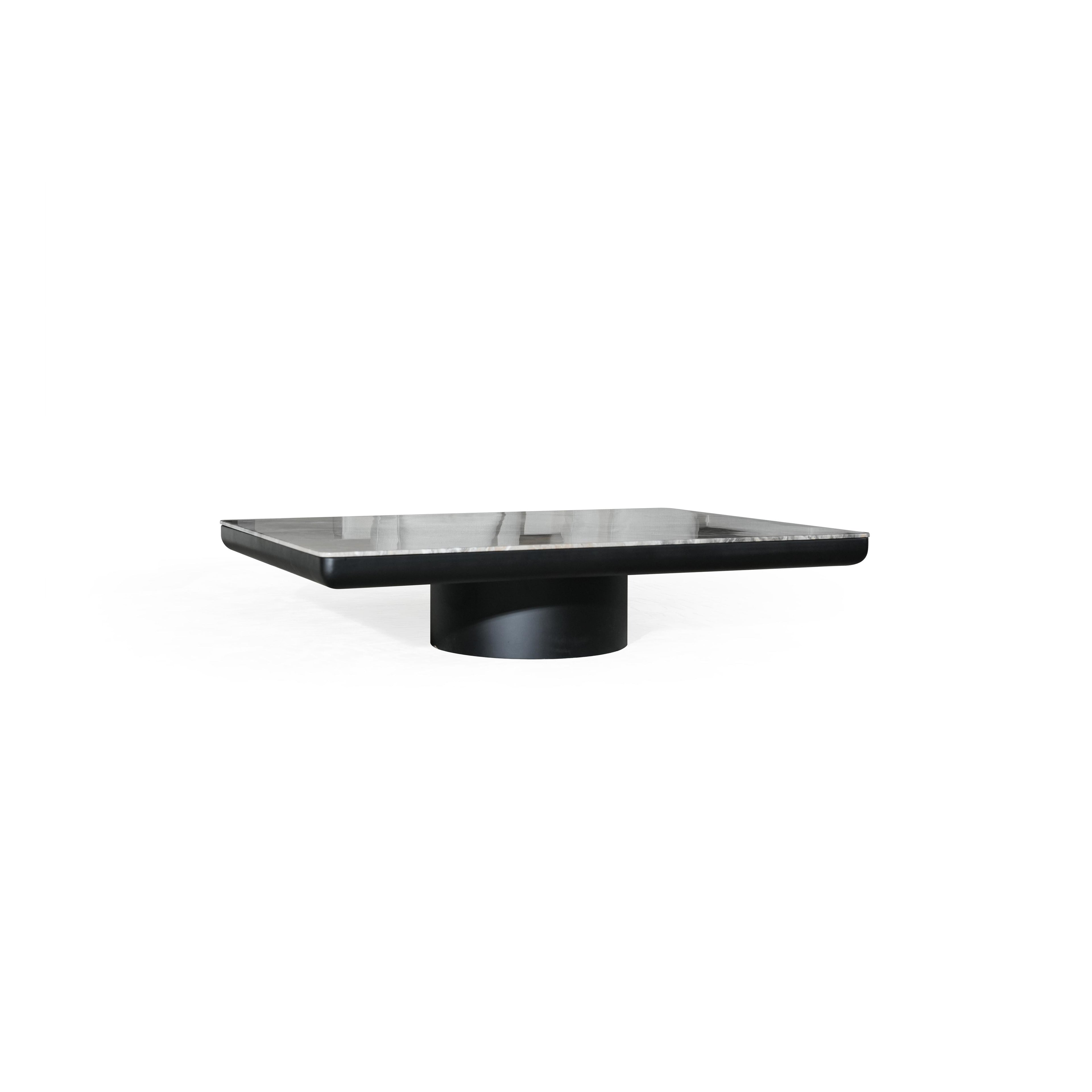 Rectangular coffee table with a black base and a gray marble top. Features a single cylindrical pedestal leg. Marble surface shows natural veining. Designed for placing items on a living room floor. Category: furniture/coffee-tables
