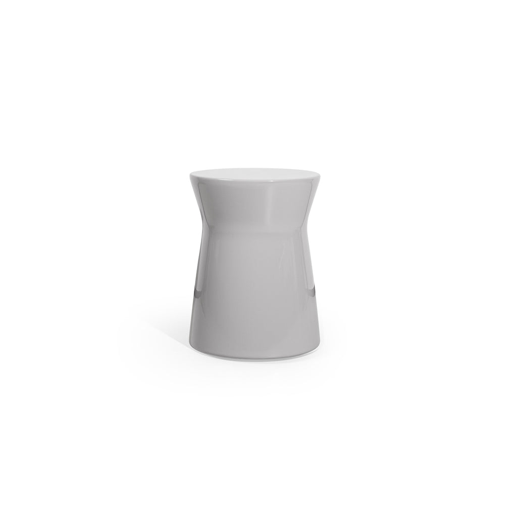 A minimalist side table with a smooth, glossy gray finish. It has a rounded top and a tapered cylindrical body that widens slightly at the base. No visible legs or structural supports. Intended for placing small items. Category: furniture/stools-and-side-tables