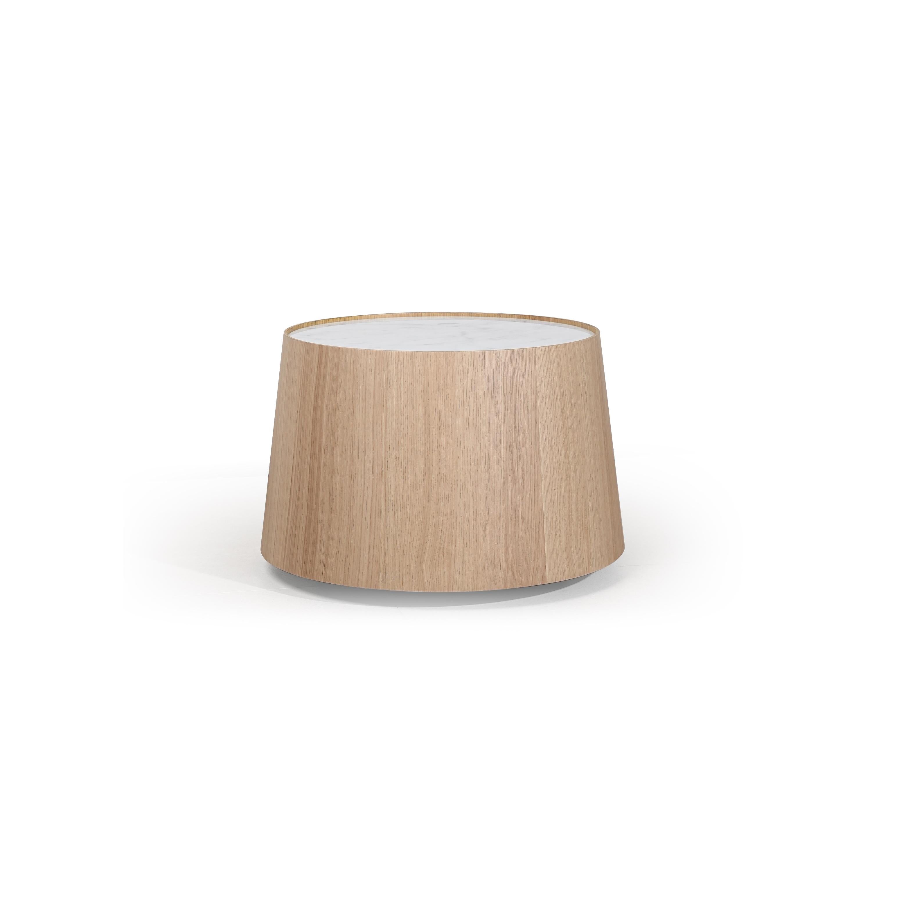 This is a round coffee table with a light wood-grain base and a white marble top. It has a tapered cylindrical form with no visible legs or supports. The wood grain runs vertically. Intended for placing items on a seating area. Category: furniture/coffee-tables