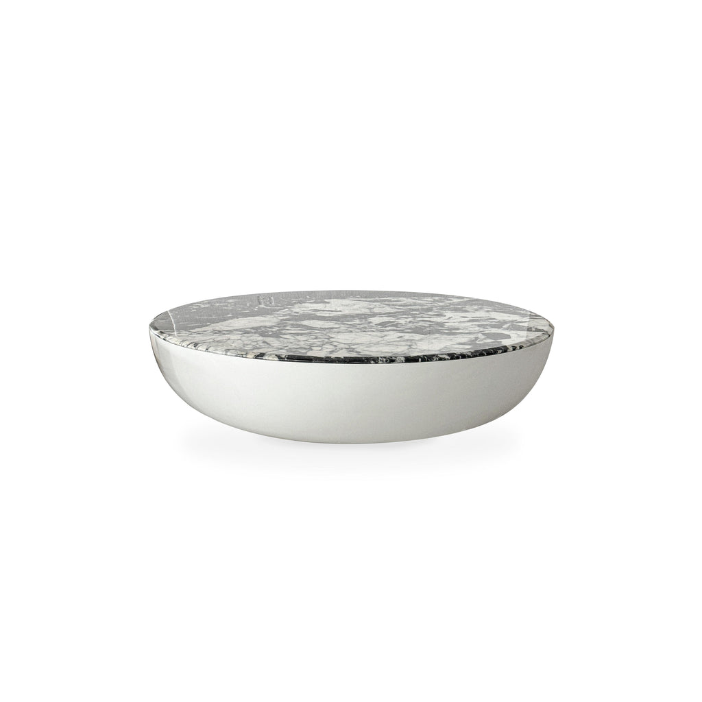 Round coffee table with a white and gray marbled top and a smooth, curved silver base. No legs or visible hardware. Intended for placing items on a floor surface. Category: furniture/coffee-tables