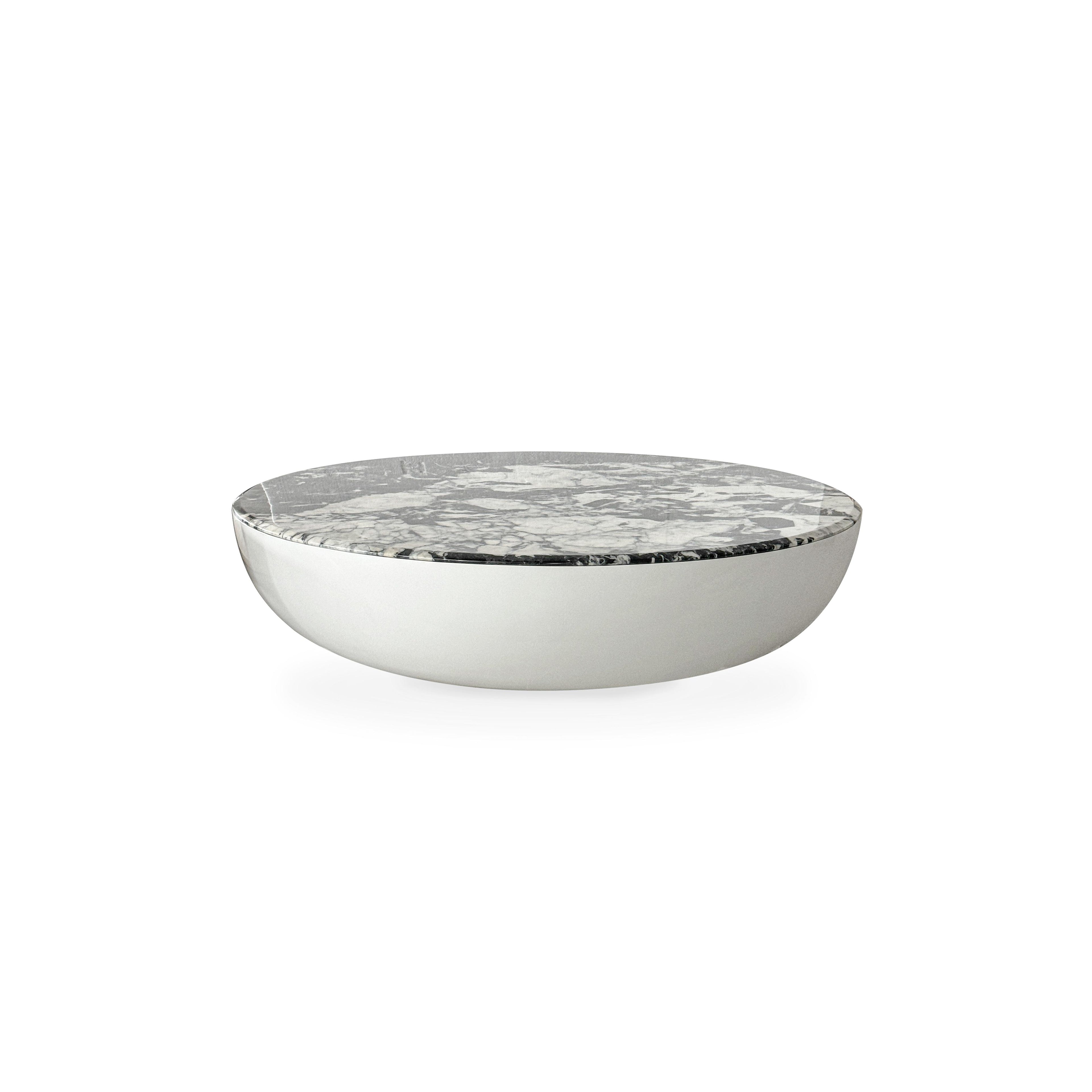 Round coffee table with a white and gray marbled top and a smooth, curved silver base. No legs or visible hardware. Intended for placing items on a floor surface. Category: furniture/coffee-tables