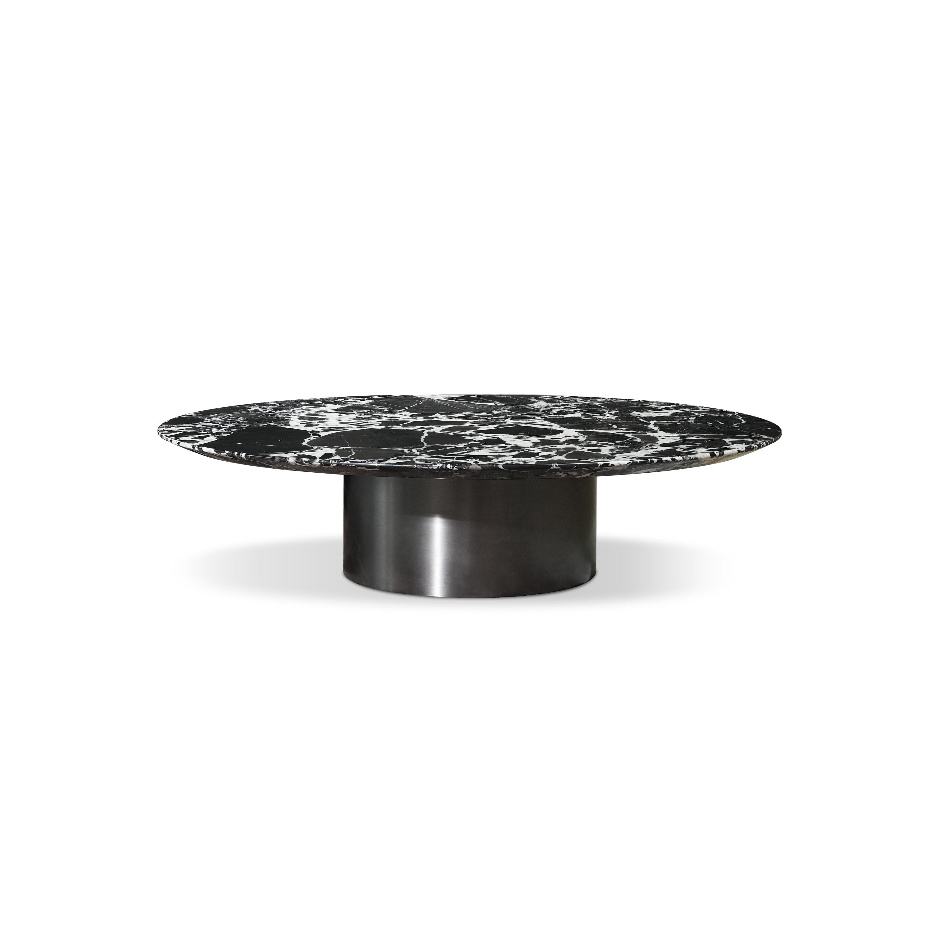 Round coffee table with black and white marbled top supported by a cylindrical metallic base; minimalist design for seating areas; smooth, reflective surface; intended for placing drinks or small items; Category: Furniture > Coffee Tables