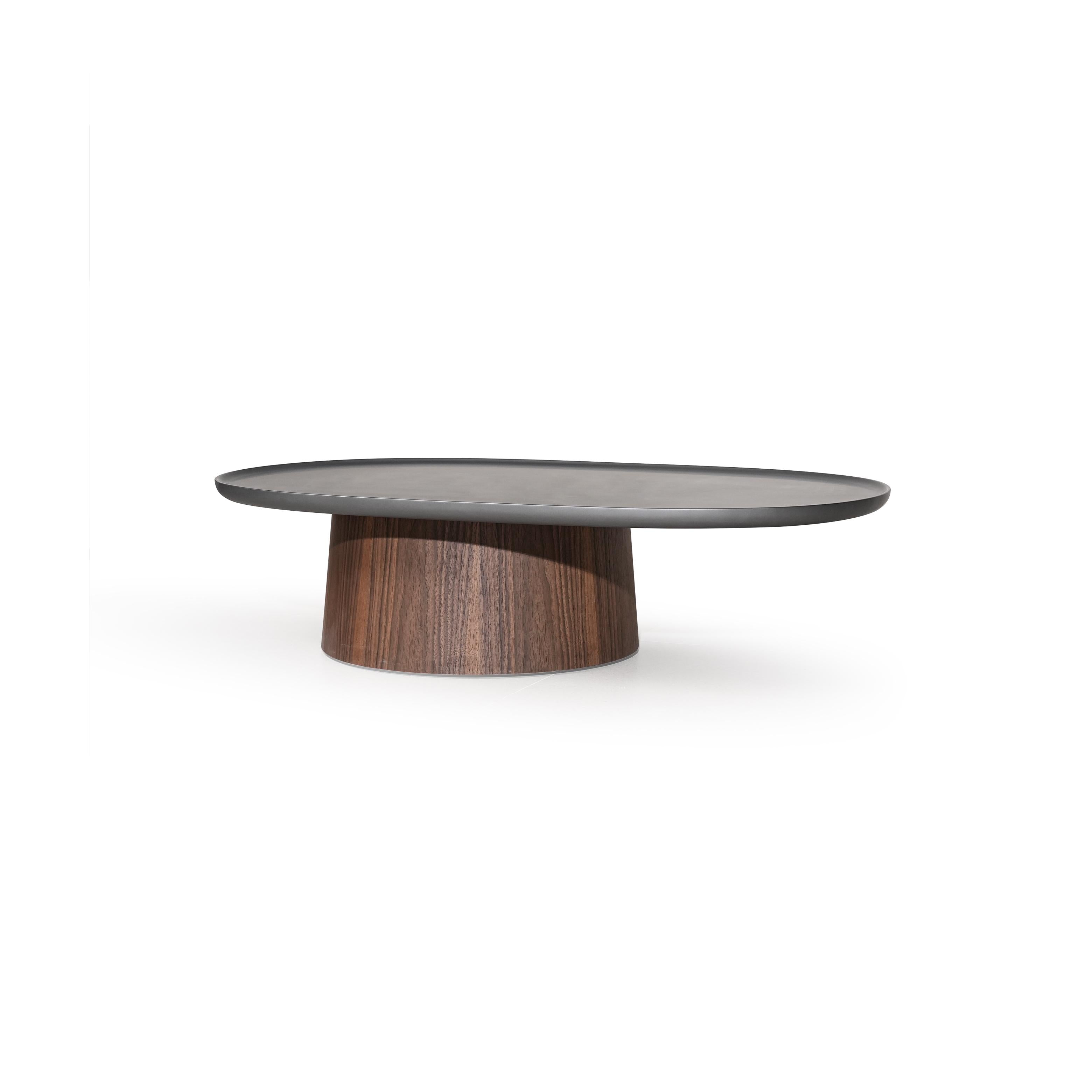 Round side table with a flat, dark gray top and a cylindrical pedestal base. No visible legs, handles, or drawers. Surface appears smooth and uniform. Intended for placing small items. Category: furniture/tables/side-tables