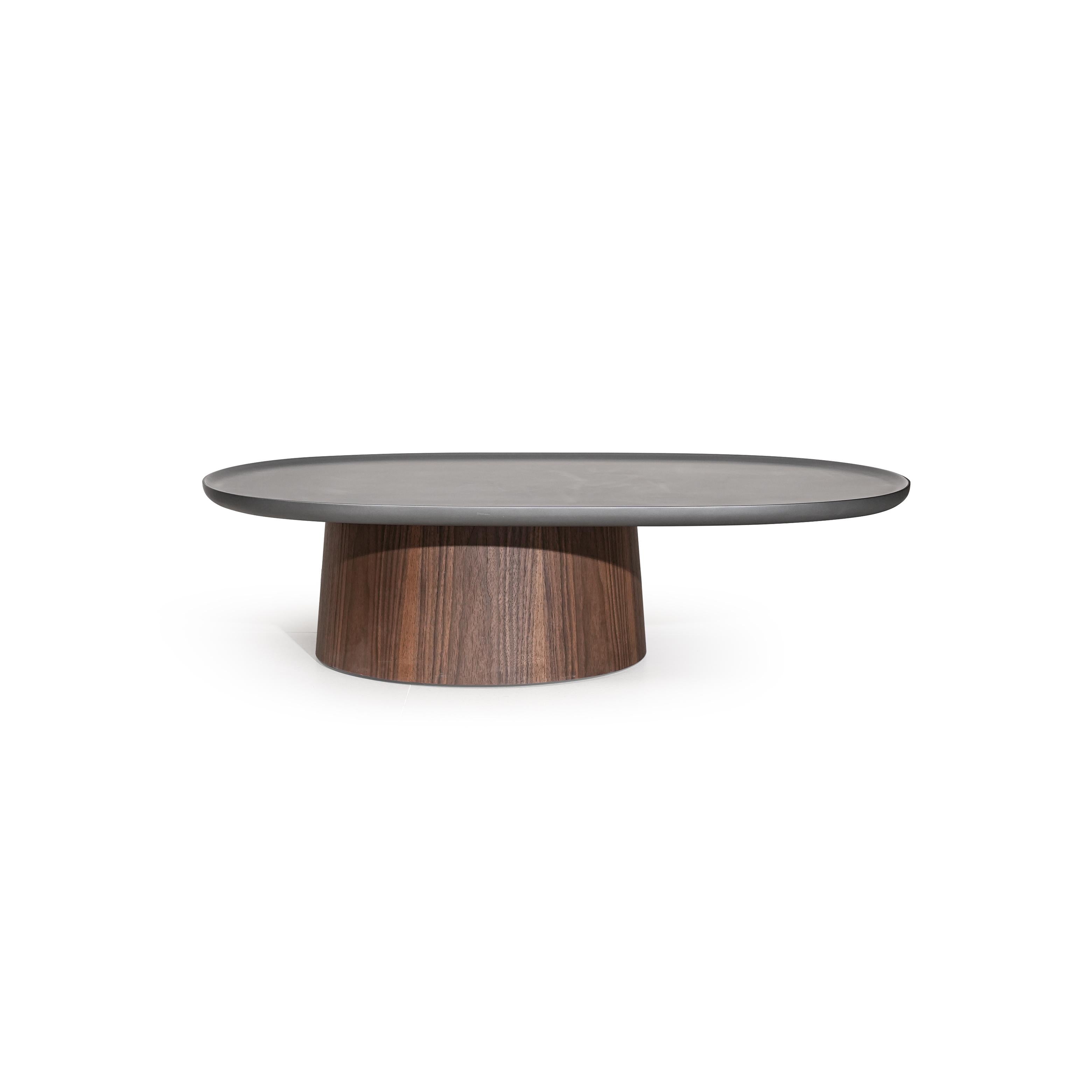 Round side table with a flat, dark gray top and a cylindrical pedestal base. No visible legs, handles, or drawers. Surface appears smooth and uniform. Intended for placing small items. Category: furniture/tables/side-tables