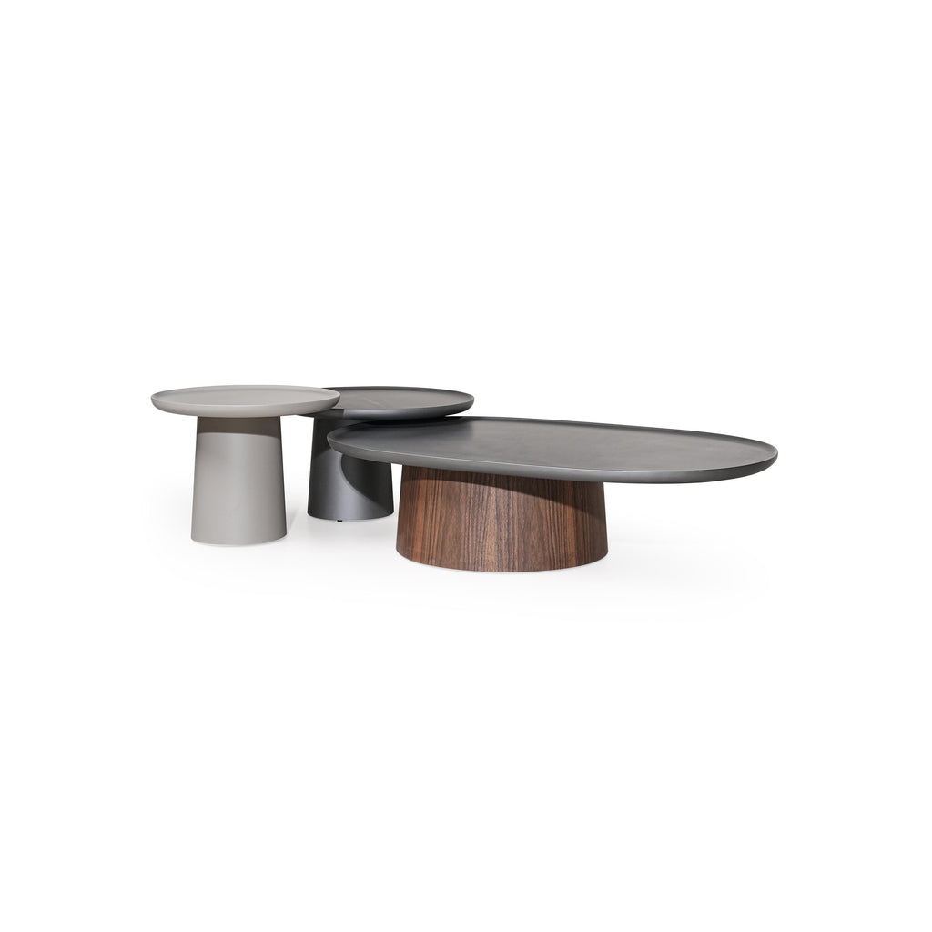 Round side table with a flat, dark gray top and a cylindrical pedestal base. No visible legs, handles, or drawers. Surface appears smooth and uniform. Intended for placing small items. Category: furniture/tables/side-tables