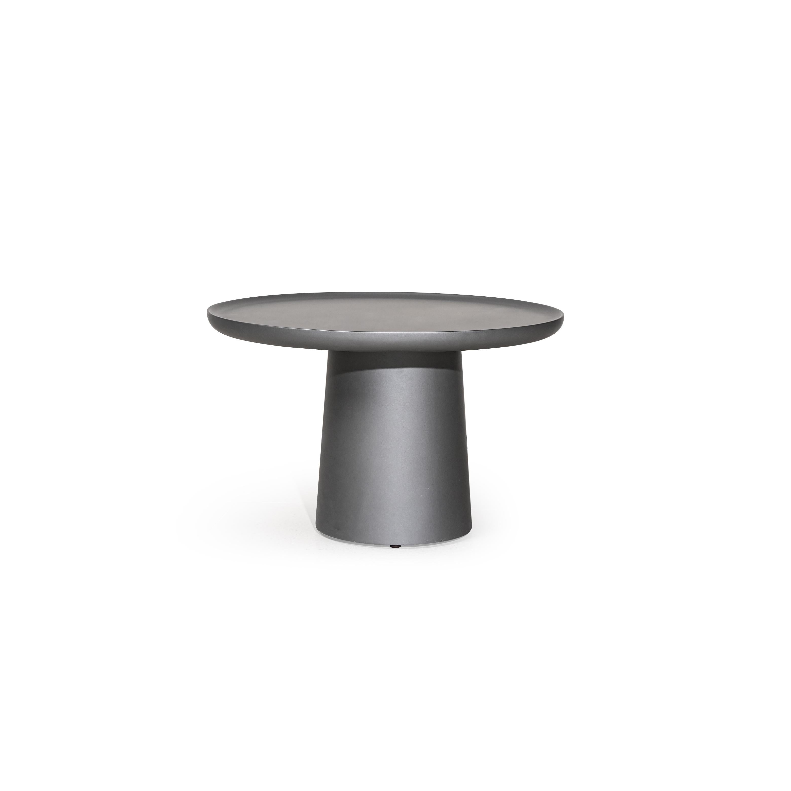 Round side table with a flat, dark gray top and a cylindrical pedestal base. No visible legs, handles, or drawers. Surface appears smooth and uniform. Intended for placing small items. Category: furniture/tables/side-tables