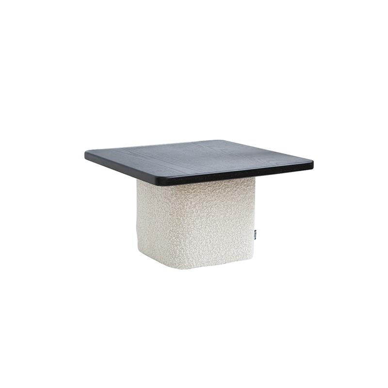 Square-top table with dark wood surface and textured off-white base, featuring a distinct fabric-wrapped pedestal structure, designed for surface placement or as a low seating option, marked with a small tag on the side. Category: Furniture > Tables > Coffee Tables