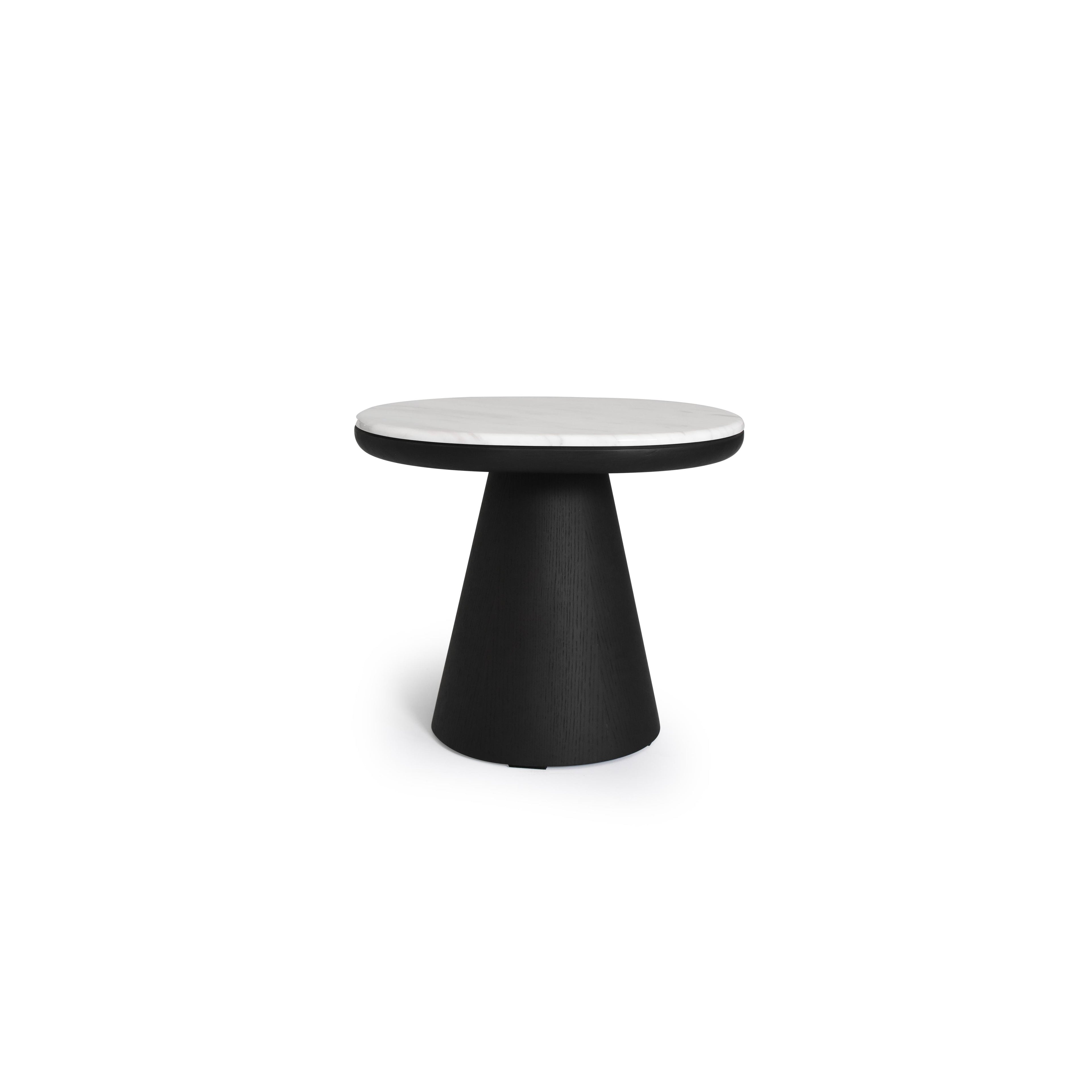 Round side table with white marble top and black wood-grain pedestal base. Features a smooth, circular tabletop supported by a tapered, conical leg. Intended for placing items like books or drinks. Category: furniture/tables/side-tables