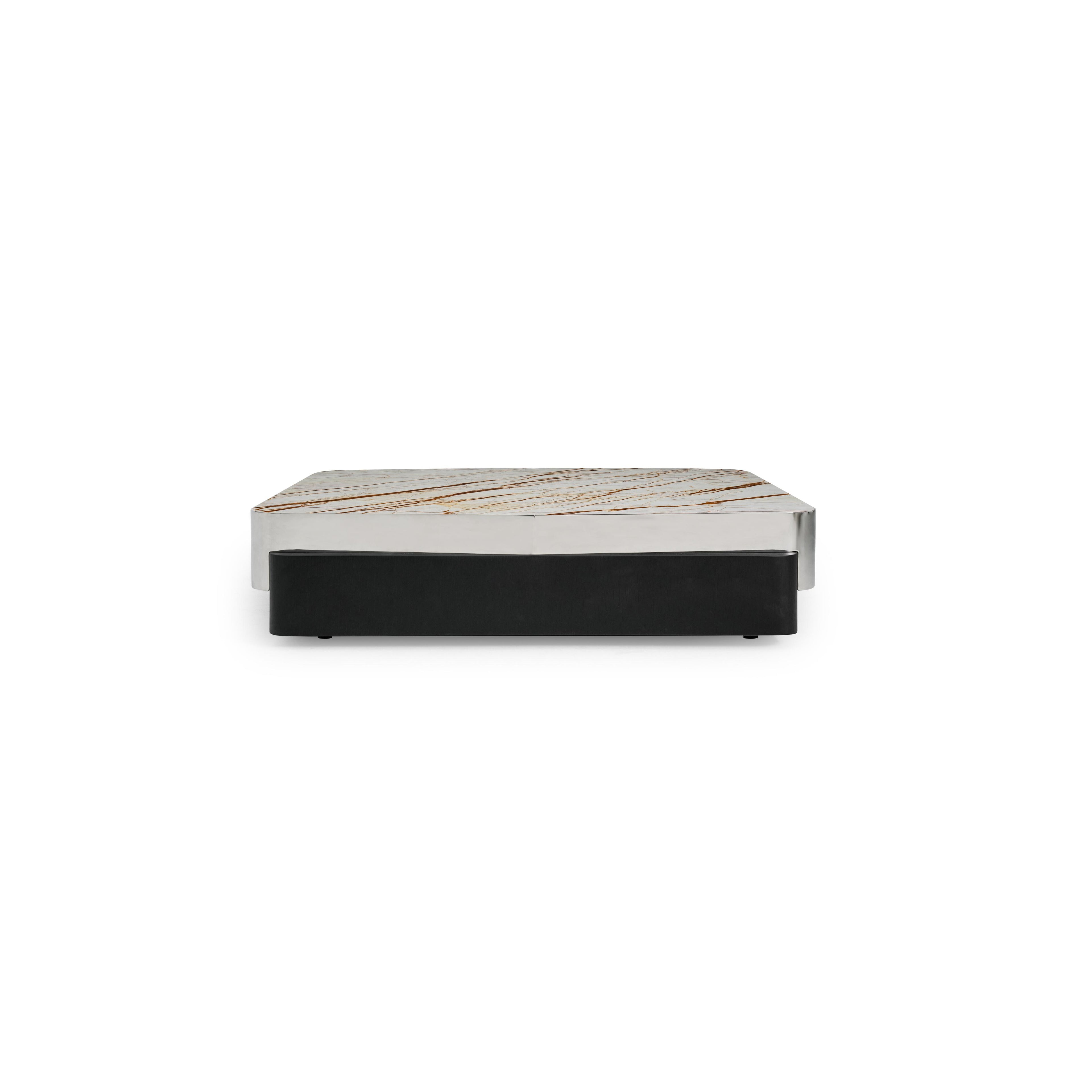 Rectangular coffee table with a white marble top featuring brown veining, supported by a black upholstered base and a silver metallic frame. Intended for placing items on a living room floor. Category: furniture/coffee-tables