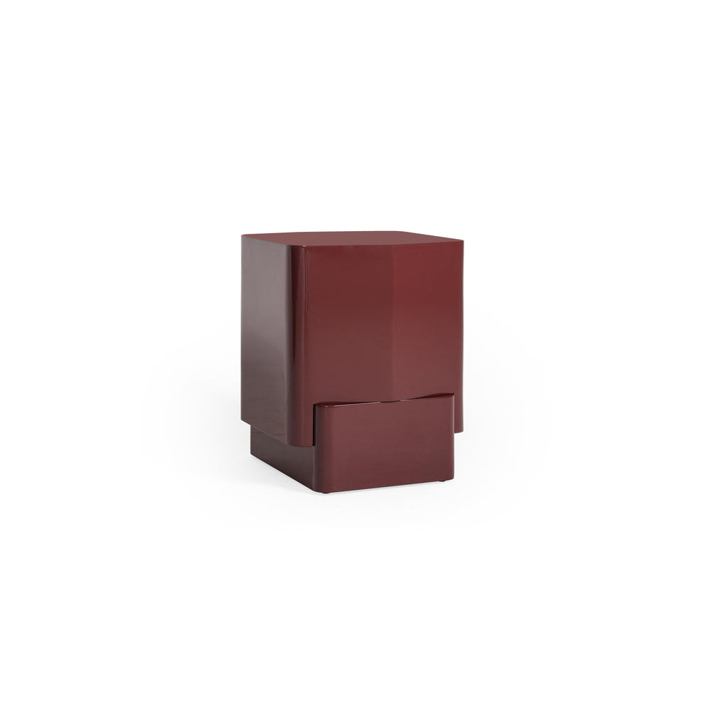 This is a modern side table with a two-tiered rectangular form in a glossy burgundy finish. It features a top shelf and a lower base, both with clean edges and no visible handles or fasteners. The surface appears smooth and uniform. Intended for placing items beside a sofa or bed. Category: Furniture > Tables > Side Tables