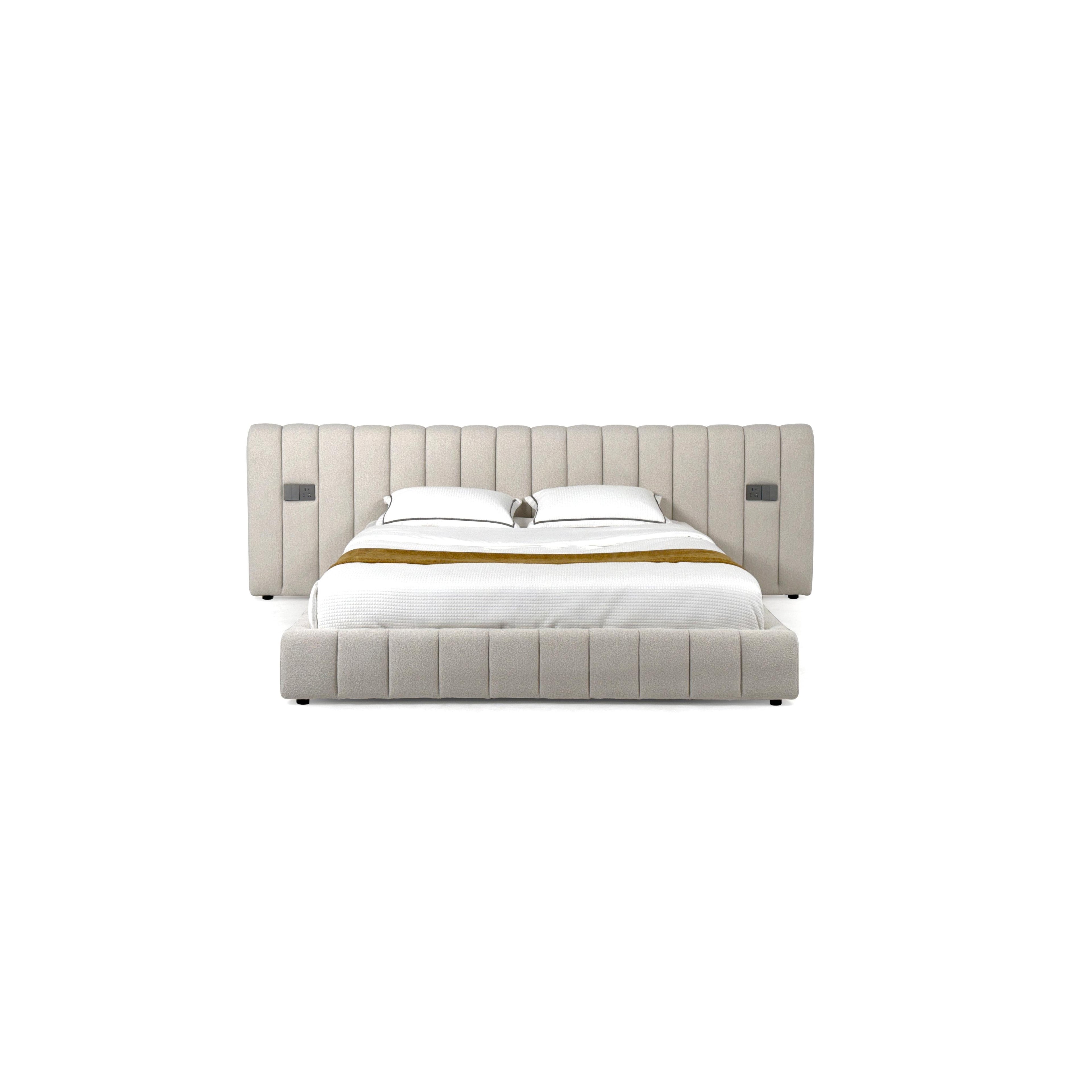 Tufted upholstered bed with a rectangular headboard and footboard, featuring vertical stitched panels, two white pillows, a white quilted mattress, and a mustard-colored throw. Black legs support the frame. Category: furniture > beds > upholstered beds