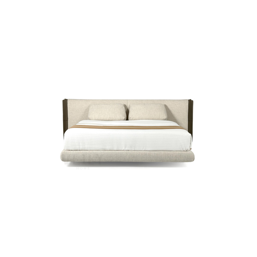 This is a upholstered bed with a low-profile frame and a padded headboard. It features two matching pillows, a white mattress cover, and a tan throw blanket. The headboard and base are covered in a textured fabric with dark brown vertical accents. The bed has four short, dark legs. Category: furniture > beds > upholstered beds
