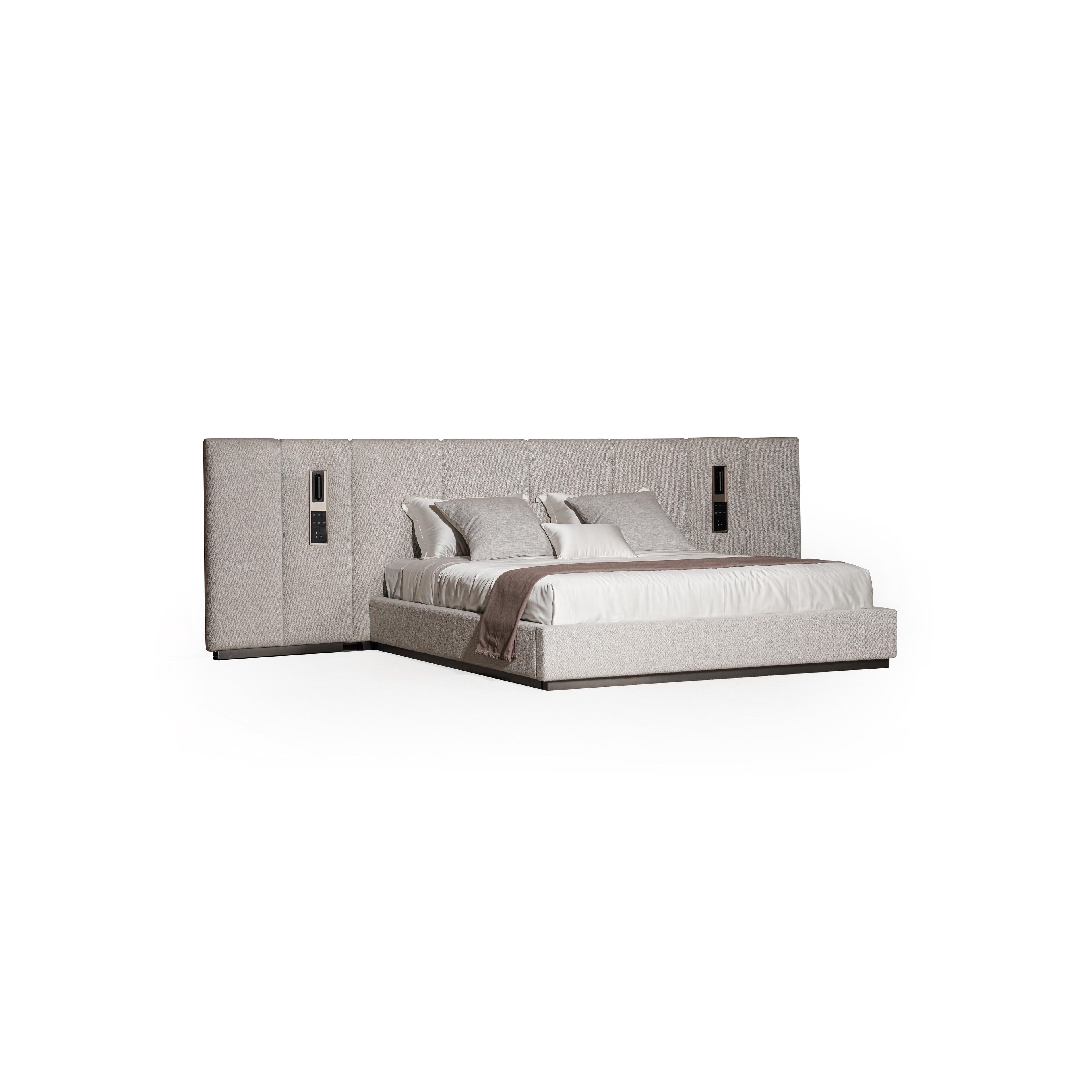 Upholstered bed with a rectangular headboard and matching footboard, featuring light gray fabric with subtle texture, two vertical panels on each side with recessed rectangular fixtures, and a white mattress with pillows; intended for sleeping; Category: furniture > beds > upholstered beds