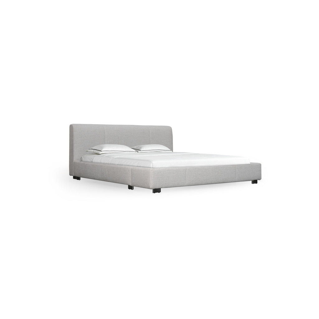 A upholstered bed with a rectangular headboard and footboard, featuring light gray fabric with subtle texture, four black legs, and two white pillows on a white mattress. Designed for sleeping, it has stitched seams and a low-profile frame. Category: furniture > beds > upholstered beds