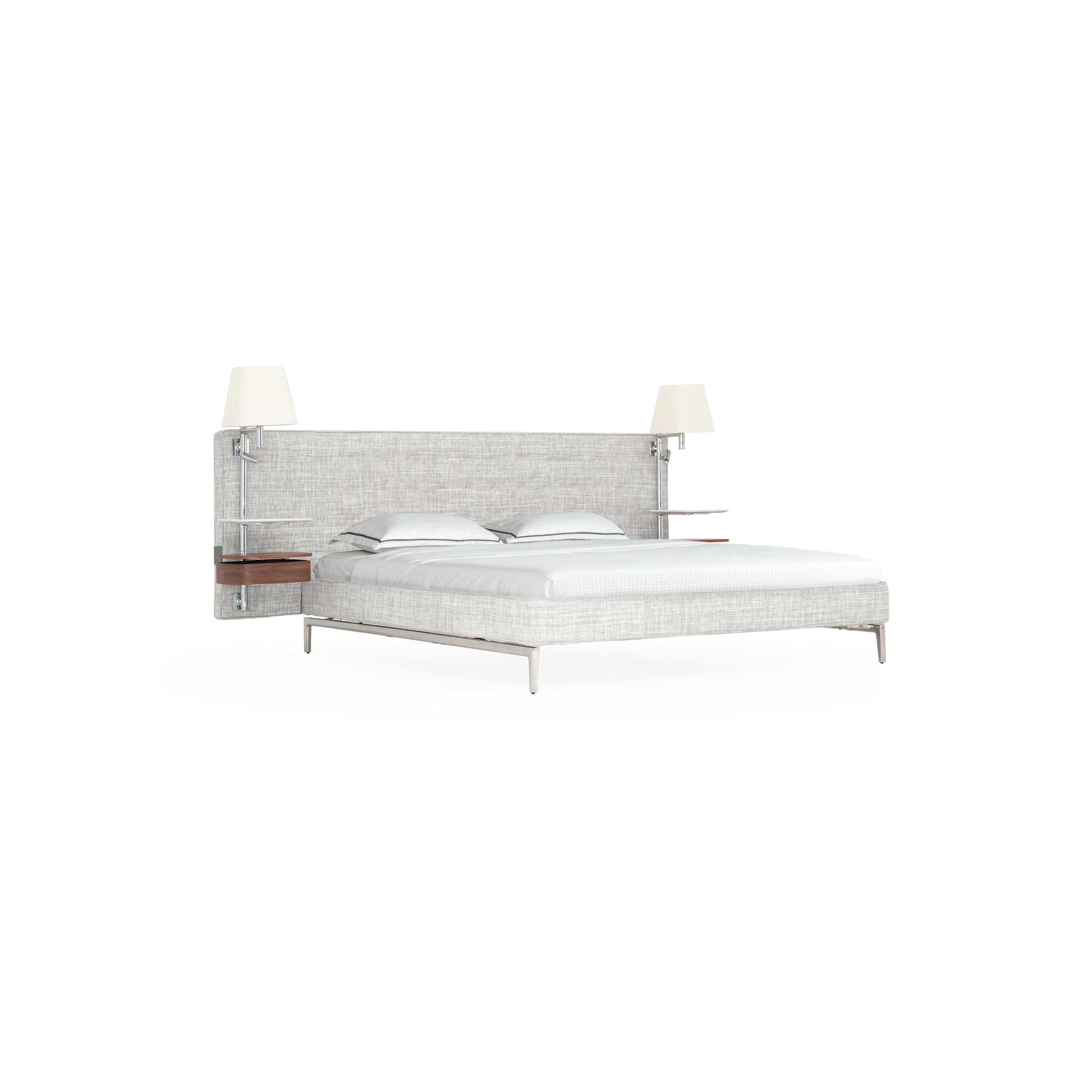 Modern upholstered bed with light gray textured fabric, metal legs, and integrated headboard with two wall-mounted lamps and wooden shelves. Features two pillows and white bedding. Intended for sleeping. Category: furniture > beds > upholstered beds