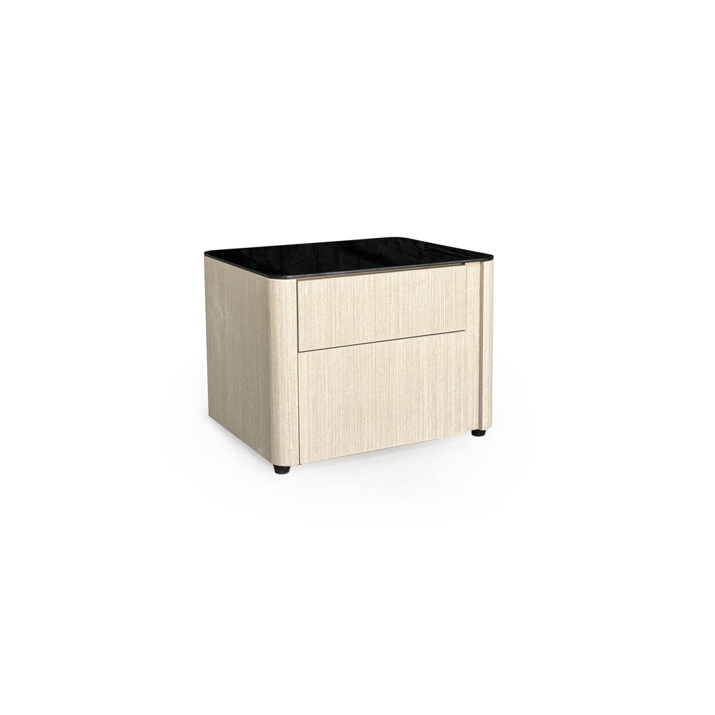 This is a two-drawer nightstand with a black glossy top and light wood-grain sides. It has rounded corners, four small black feet, and no visible handles. Designed for bedside storage, it features a flat front with vertical grain texture. Category: furniture/nightside-tables