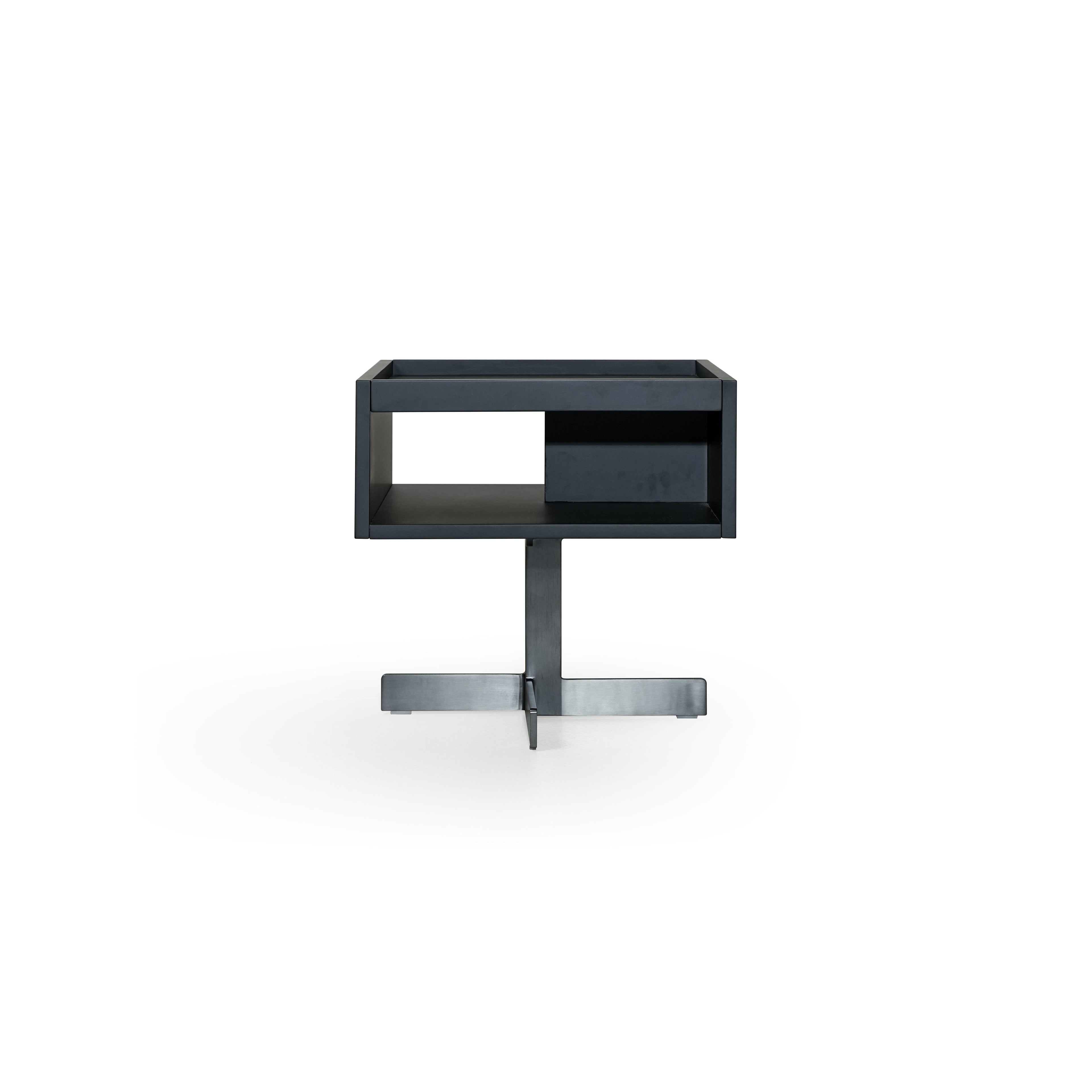 Black rectangular side table with open shelf and recessed compartment, supported by a cross-shaped base; matte finish, no visible texture or fabric; designed for holding items or displaying objects; Category: furniture/side-tables