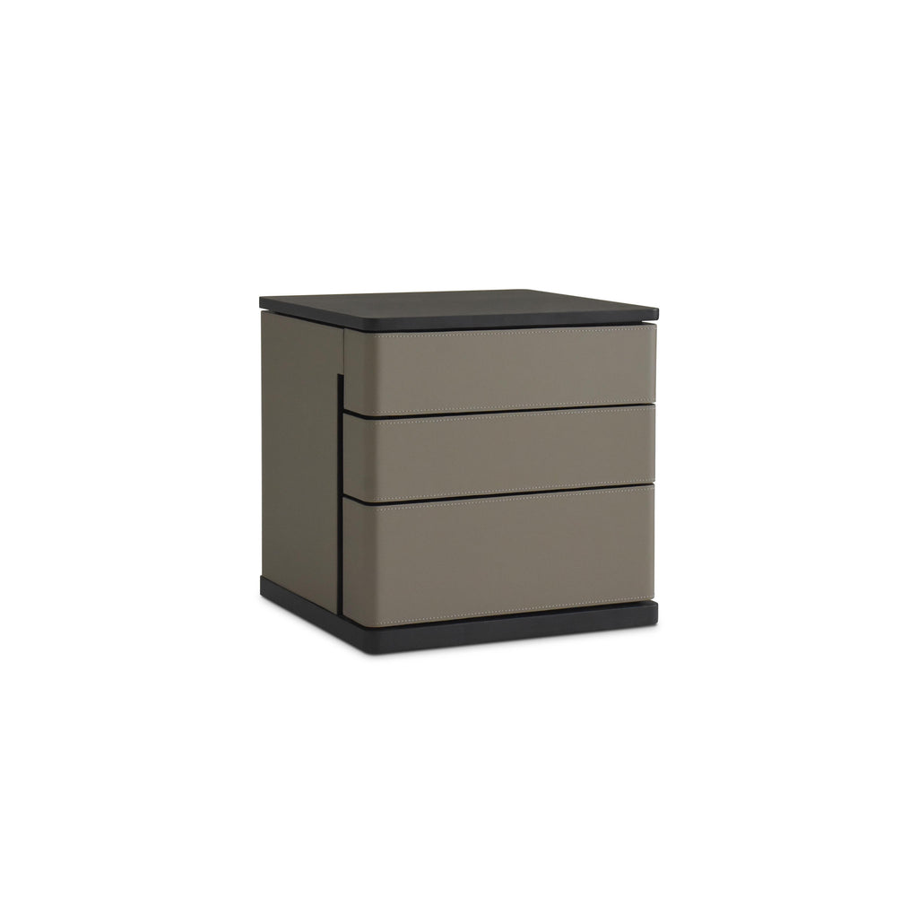 Three-drawer nightstand with matte taupe drawers and black top and base; rectangular form with vertical stitching along drawer edges; no handles or visible fasteners; intended for bedside storage; Category: furniture/nightside-tables