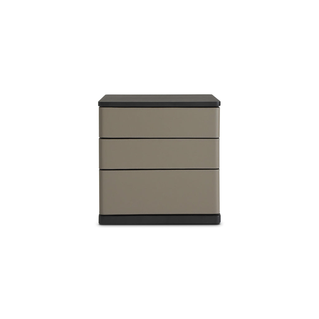 Three-drawer nightstand with matte taupe drawers and black top and base; rectangular form with vertical stitching along drawer edges; no handles or visible fasteners; intended for bedside storage; Category: furniture/nightside-tables