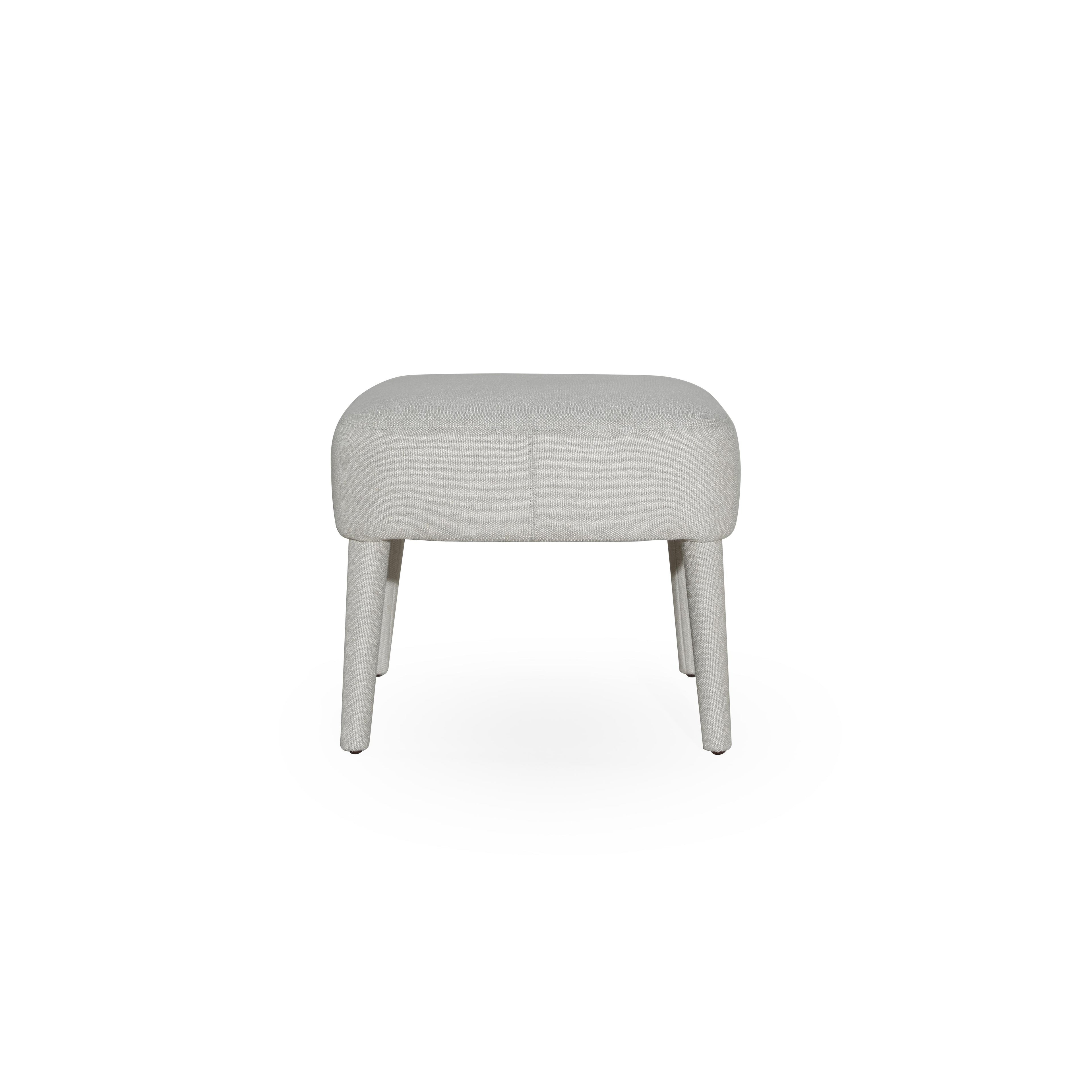 This upholstered stool has a rectangular seat with visible stitching and four tapered legs. The fabric upholstery is light gray with a textured weave. It is designed for seating or as a footrest. Category: Furniture > Stools