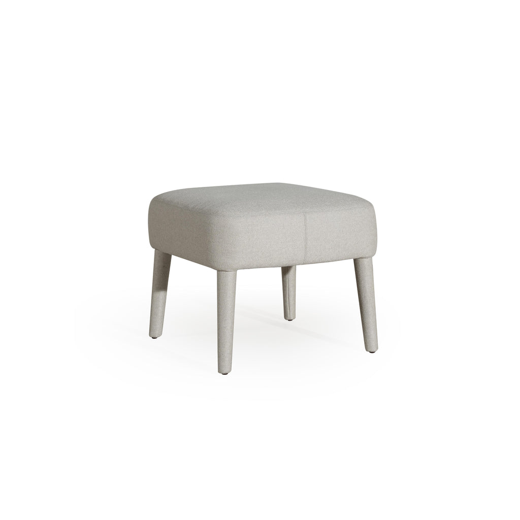 This upholstered stool has a rectangular seat with visible stitching and four tapered legs. The fabric upholstery is light gray with a textured weave. It is designed for seating or as a footrest. Category: Furniture > Stools