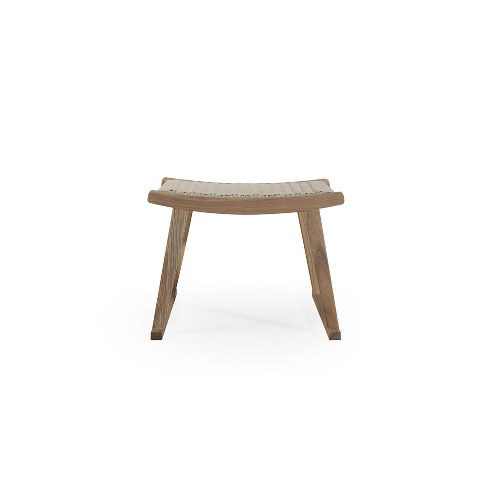 A wooden footstool with a curved, woven seat surface and angled legs forming a stable base. The seat features a light-colored, tightly woven texture. The frame is made of wood with visible grain. Intended for footrest use. Category: Furniture > Stools > Footstools