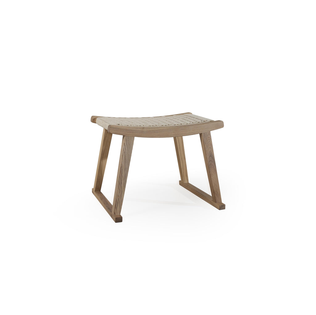 A wooden footstool with a curved, woven seat surface and angled legs forming a stable base. The seat features a light-colored, tightly woven texture. The frame is made of wood with visible grain. Intended for footrest use. Category: Furniture > Stools > Footstools