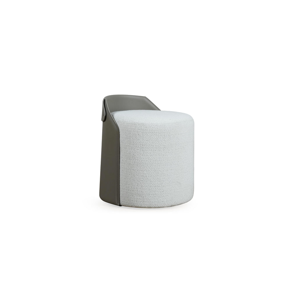 This is a cylindrical upholstered stool with a light gray fabric body and a darker gray leather-like top rim. It has no visible legs or frame, suggesting a seated surface designed for footrest or small seating. The fabric shows a textured weave. Intended for casual seating or as a decorative accent. Category: Furniture > Stools