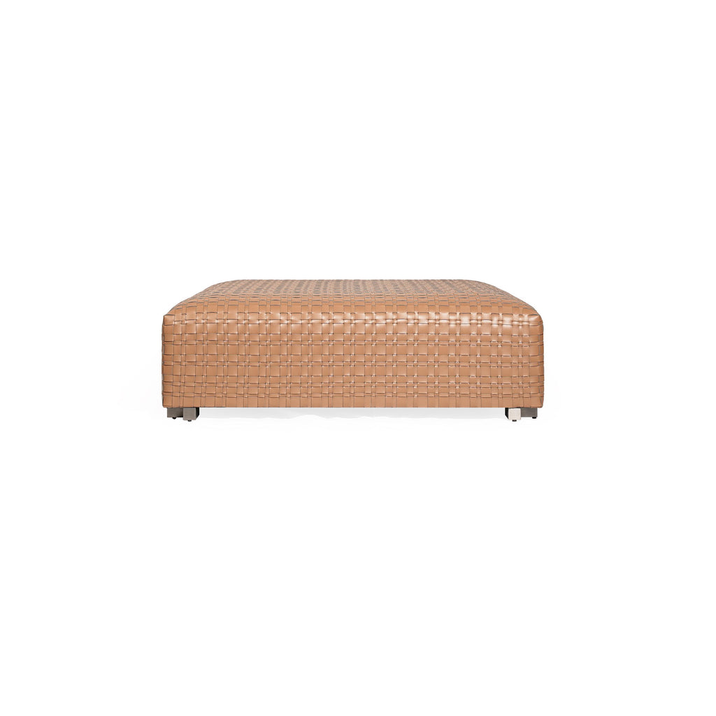 Rectangular ottoman with tan woven leather surface, four short metallic legs, and a uniform grid pattern across its top and sides, designed for seating or as a footrest. Category: Furniture > Seating > Ottomans