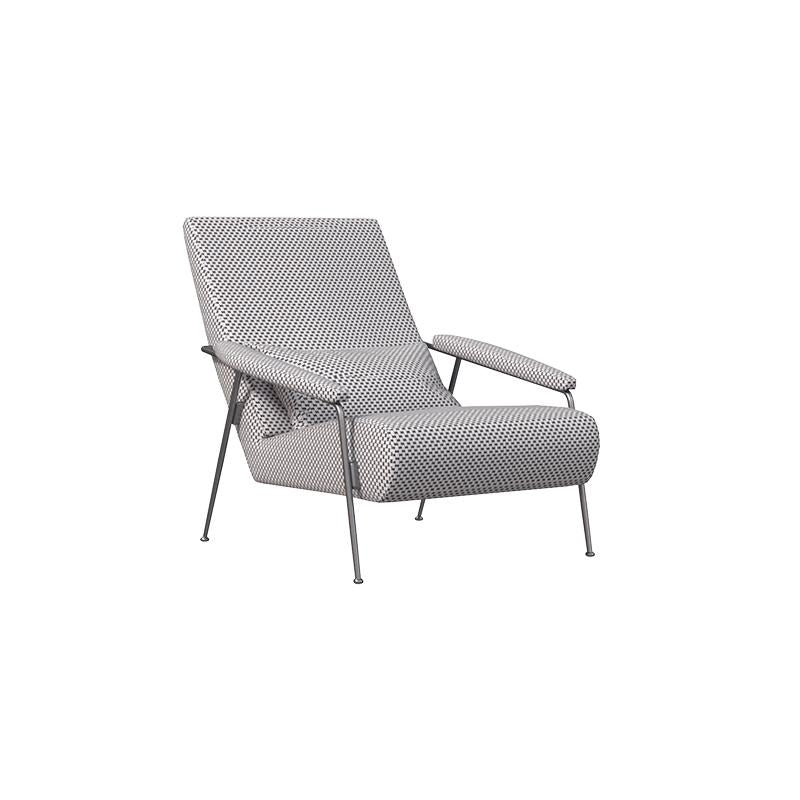 Armchair with patterned fabric upholstery, angled backrest, curved armrests, and four slender metal legs. Features stitched seams and padded seat and back cushions. Designed for seated relaxation. Category: Furniture > Chairs > Armchairs