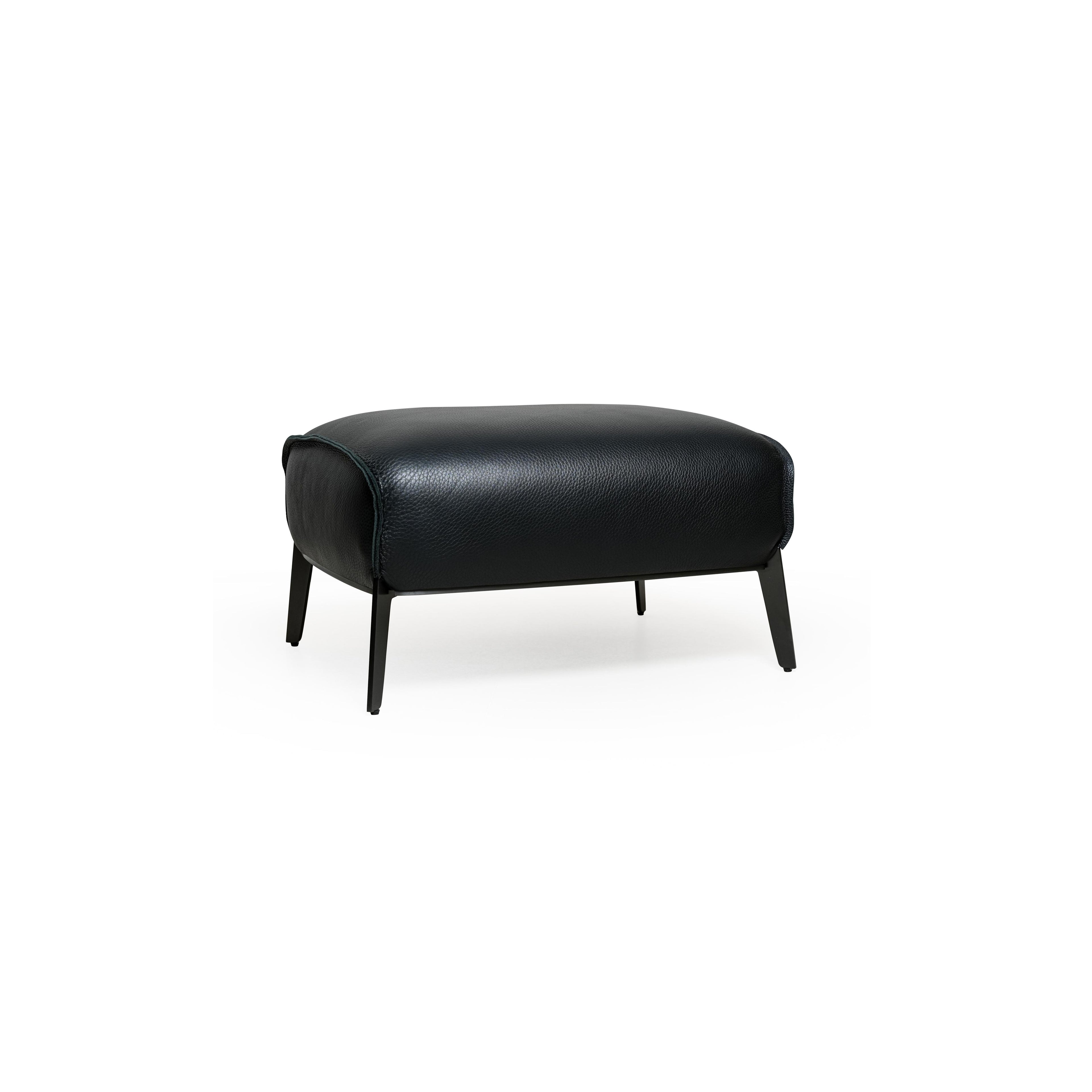 Black leather-like upholstered armchair with curved backrest, padded arms, and a rounded seat supported by four slender metallic legs; designed for seated comfort in living or lounge areas. Category: furniture/armchairs