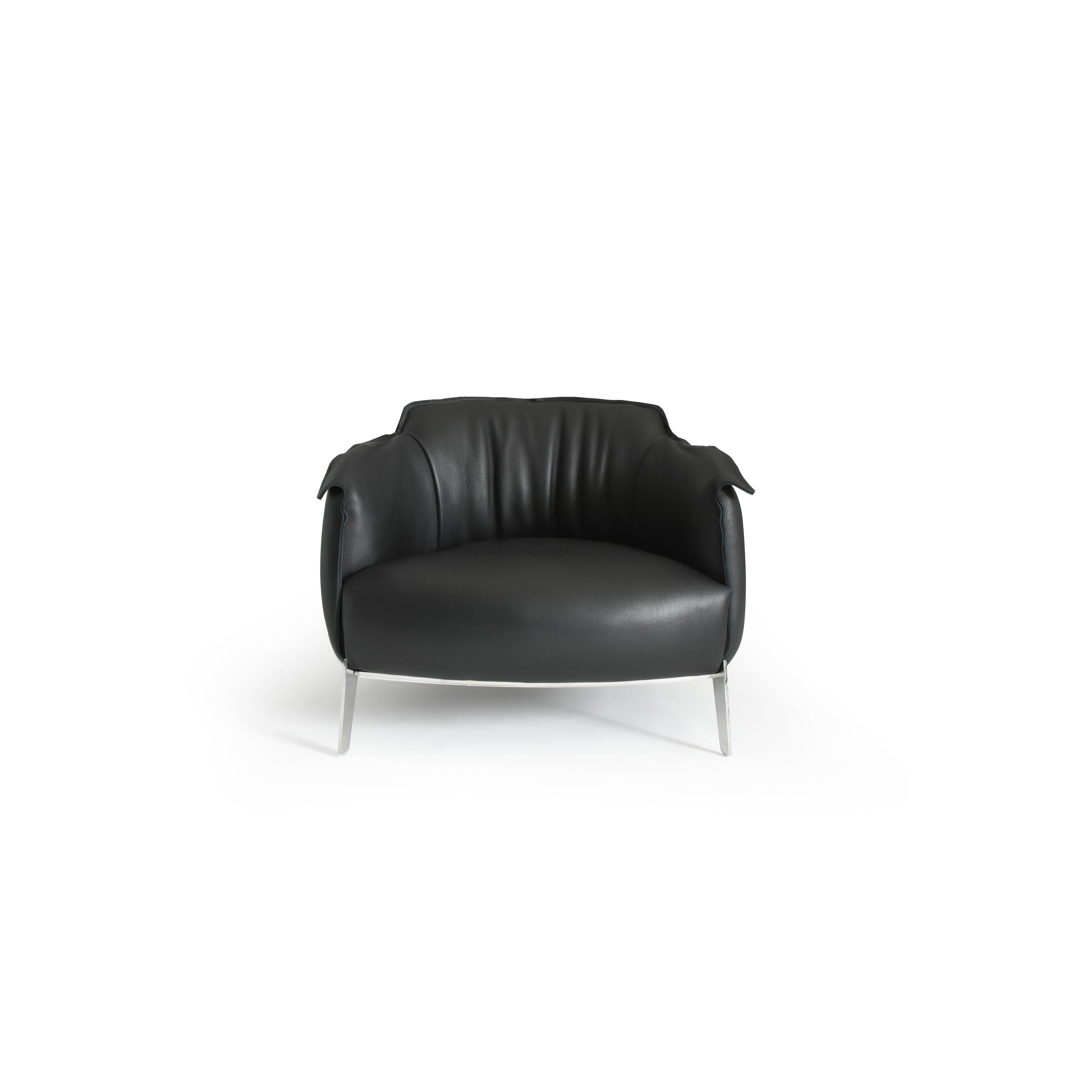 Black leather-like upholstered armchair with curved backrest, padded arms, and a rounded seat supported by four slender metallic legs; designed for seated comfort in living or lounge areas. Category: furniture/armchairs