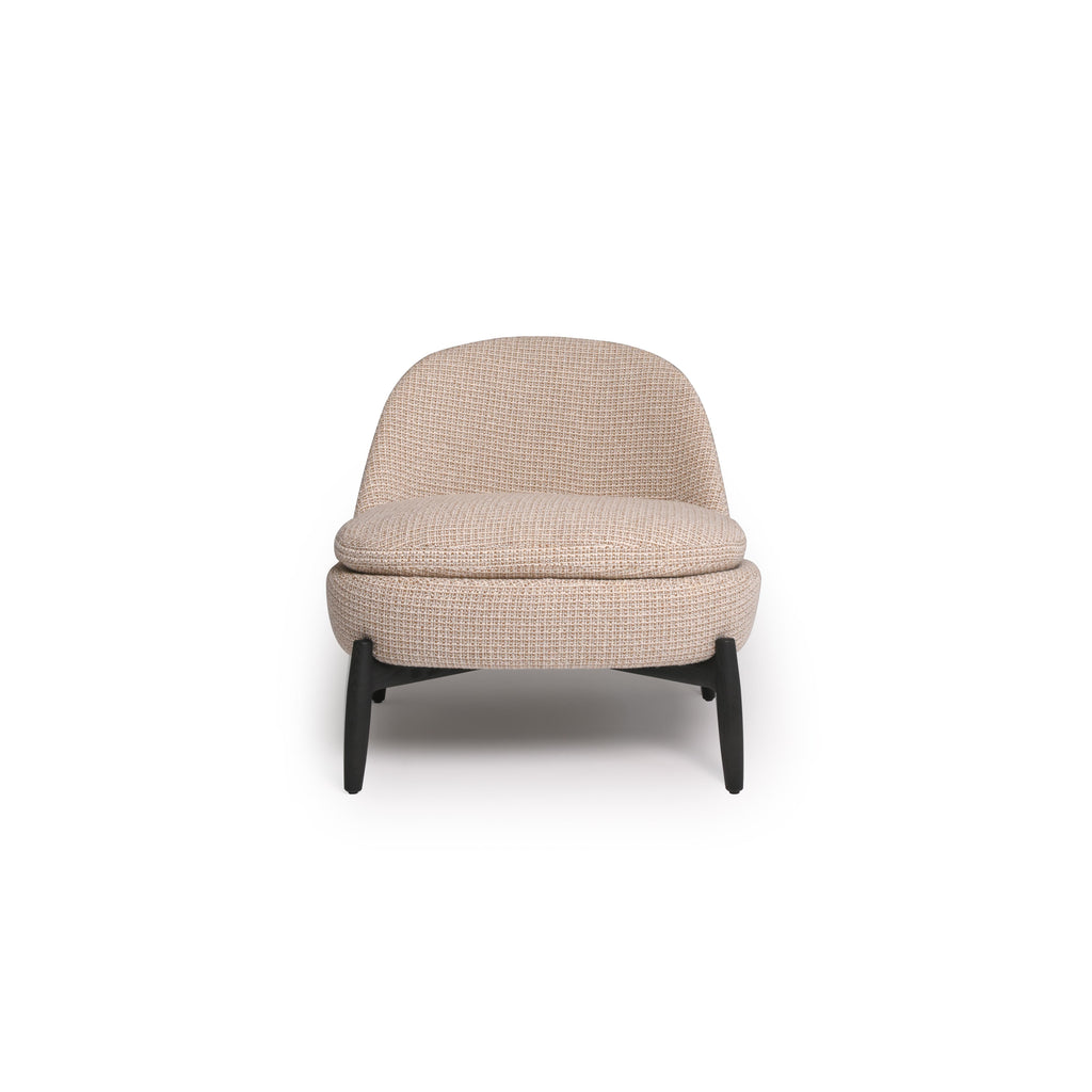 This is a single-seater armchair with a rounded backrest and seat, upholstered in a beige woven fabric. It has four dark, tapered legs supporting the frame. The cushioned seat and backrest are stitched together with visible seams. Intended for seating, it features a compact, modern silhouette. Category: Furniture > Chairs > Armchairs