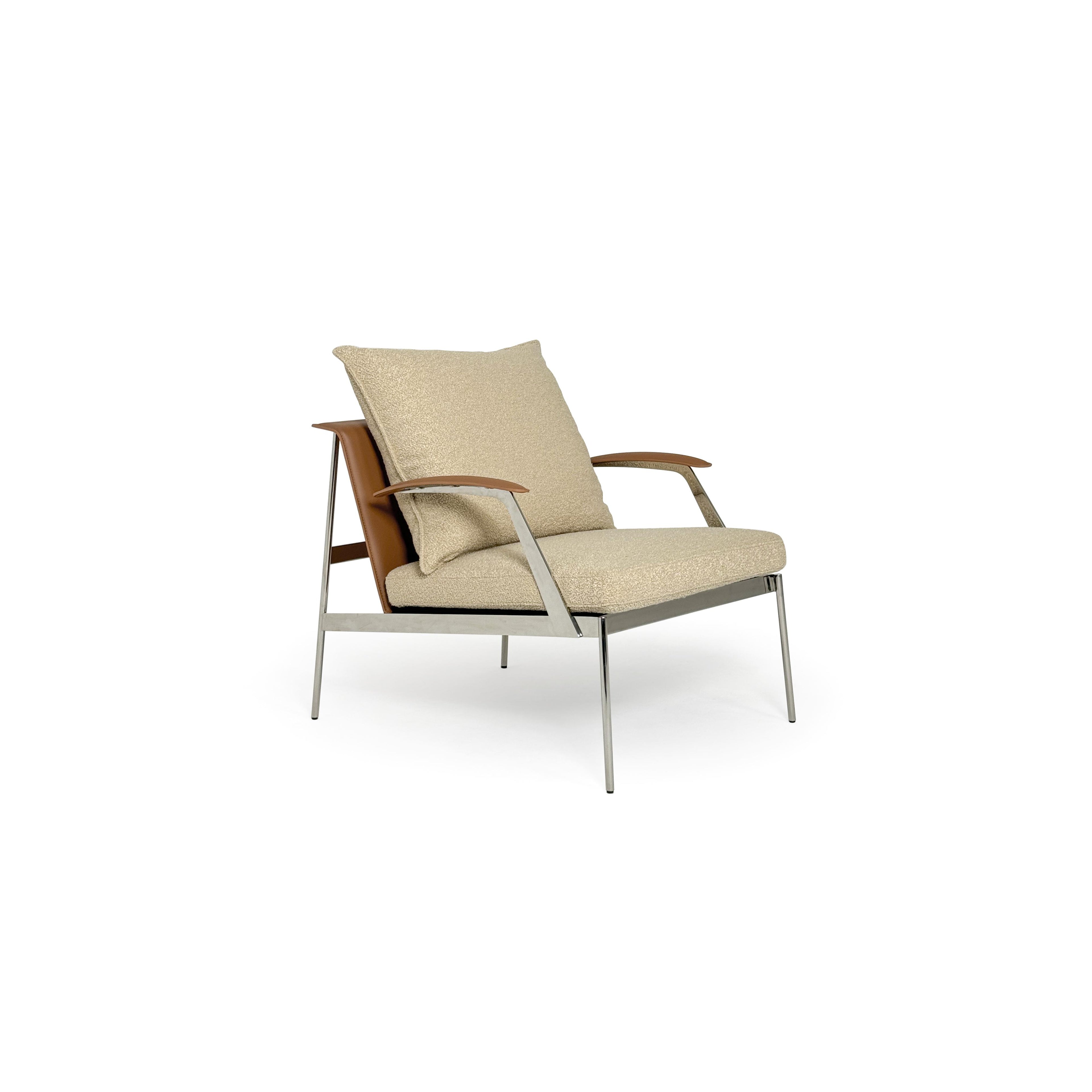 Armchair with beige boucle fabric upholstery, wooden armrests, and chrome metal legs. Features a cushioned seat and backrest, stitched seams, and a sleek, modern silhouette. Designed for seated comfort in living spaces. Category: Furniture > Chairs > Armchairs
